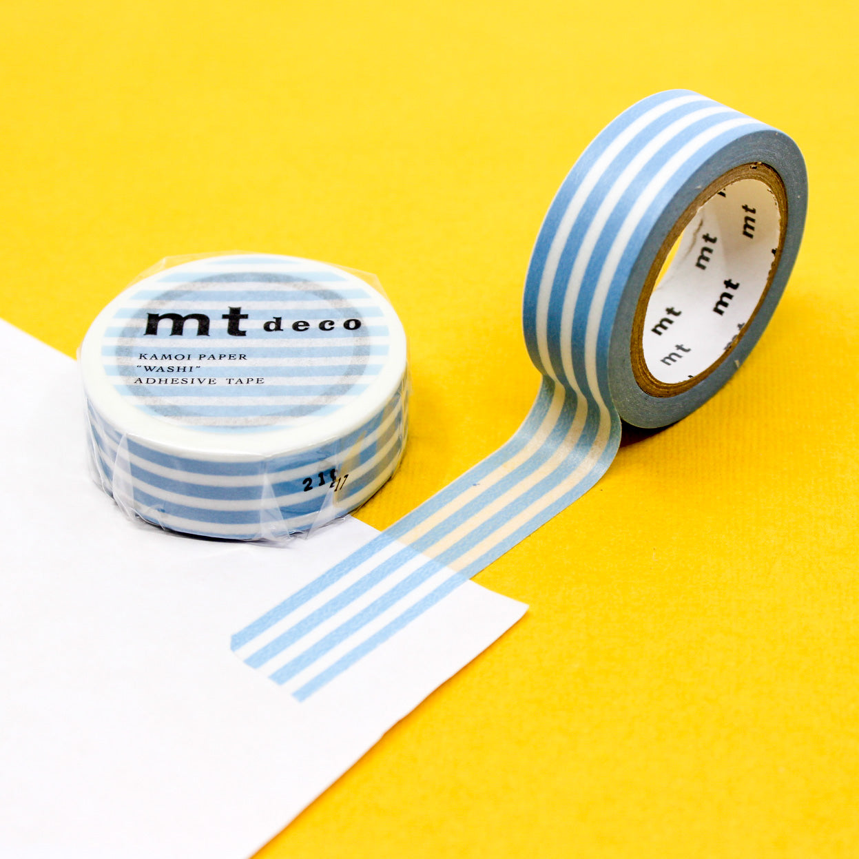 Enhance your crafts with our thicker line horizontal stripe washi tape, featuring bold and stylish stripes in a variety of colors, perfect for adding a dynamic and vibrant element to your projects. This Baby Blue Stripe tape is from MT Brand Masking Tape and sold at BBB Supplies Craft Shop.