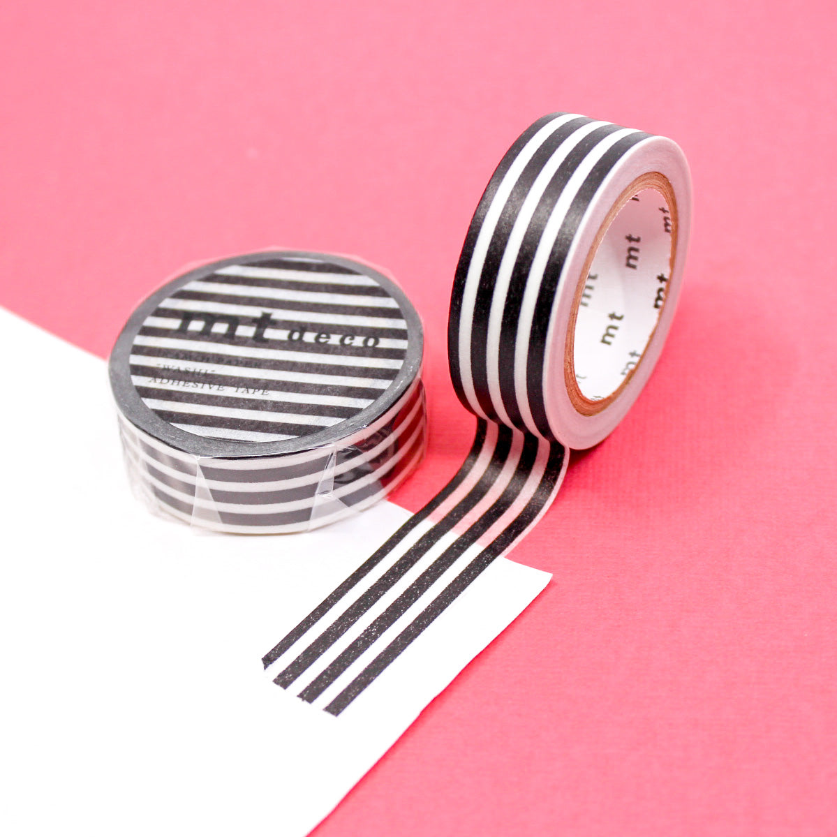 Enhance your crafts with our thicker line horizontal stripe washi tape, featuring bold and stylish stripes in a variety of colors, perfect for adding a dynamic and vibrant element to your projects. This Black Stripe tape is from MT Brand Masking Tape and sold at BBB Supplies Craft Shop.