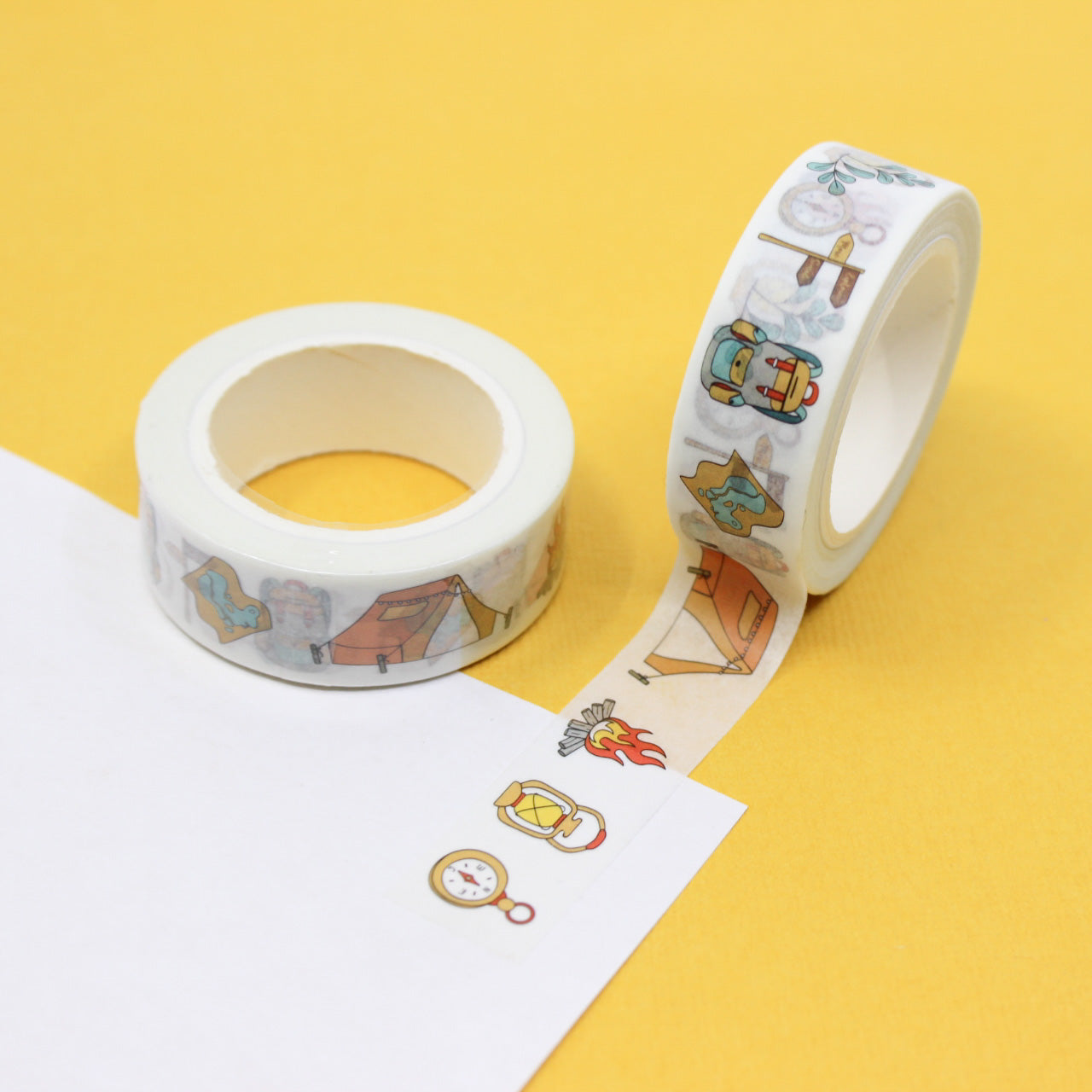 This washi tape features various camping supplies like tents, campfires, and backpacks, ideal for adding a rustic outdoor touch to your projects or journals. This tape is sold at BBB Supplies Craft Shop.