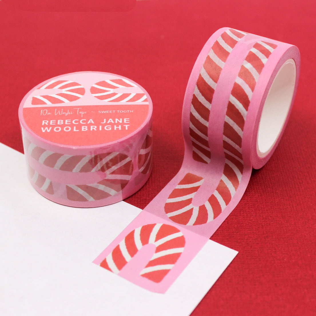 Sweet Tooth Candy Cane Washi Tape showcasing delightful candy canes in a whimsical pattern, adding a sugary and festive flair to your crafting or holiday-themed projects. This tape is from Rebecca Jane Woolbright and sold at BBB Supplies Craft Shop.