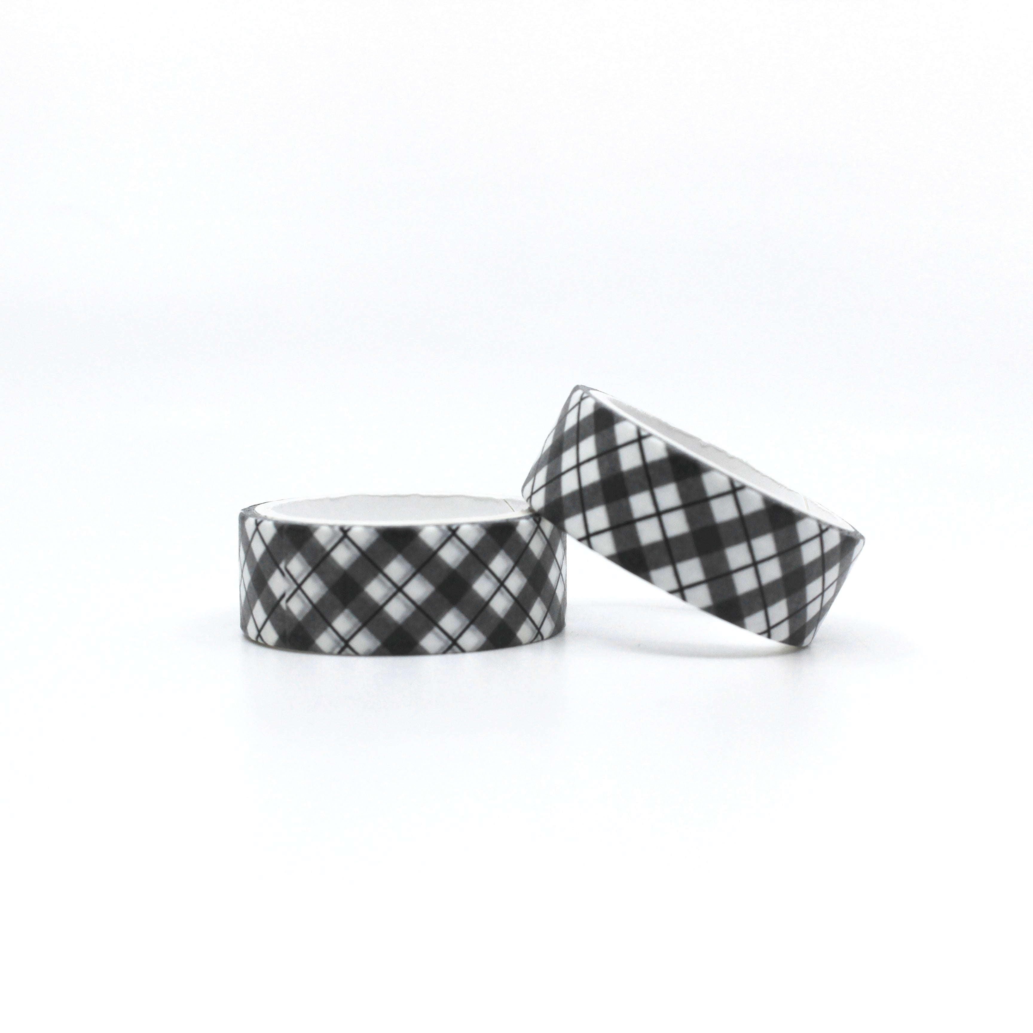 Infuse your projects with a sense of timeless style using our black and white plaid lattice pattern washi tape, adorned with a chic and versatile lattice design. This tape is sold at BBB Supplies Craft Shop.