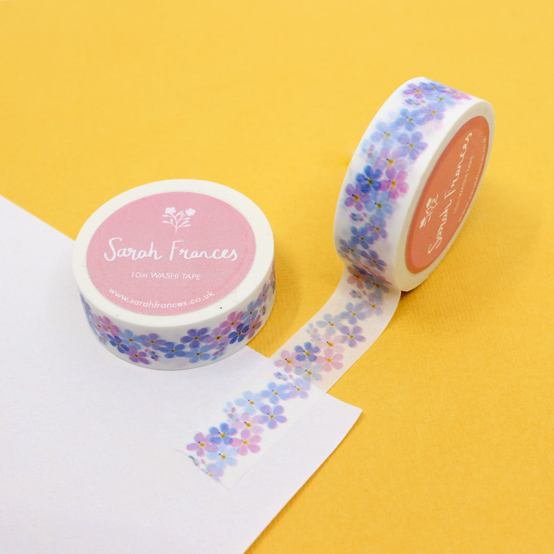 "Purple Forget-Me-Nots Floral Washi Tape" showcases a beautiful pattern of delicate purple forget-me-not flowers, perfect for adding a touch of floral elegance to your creative projects.