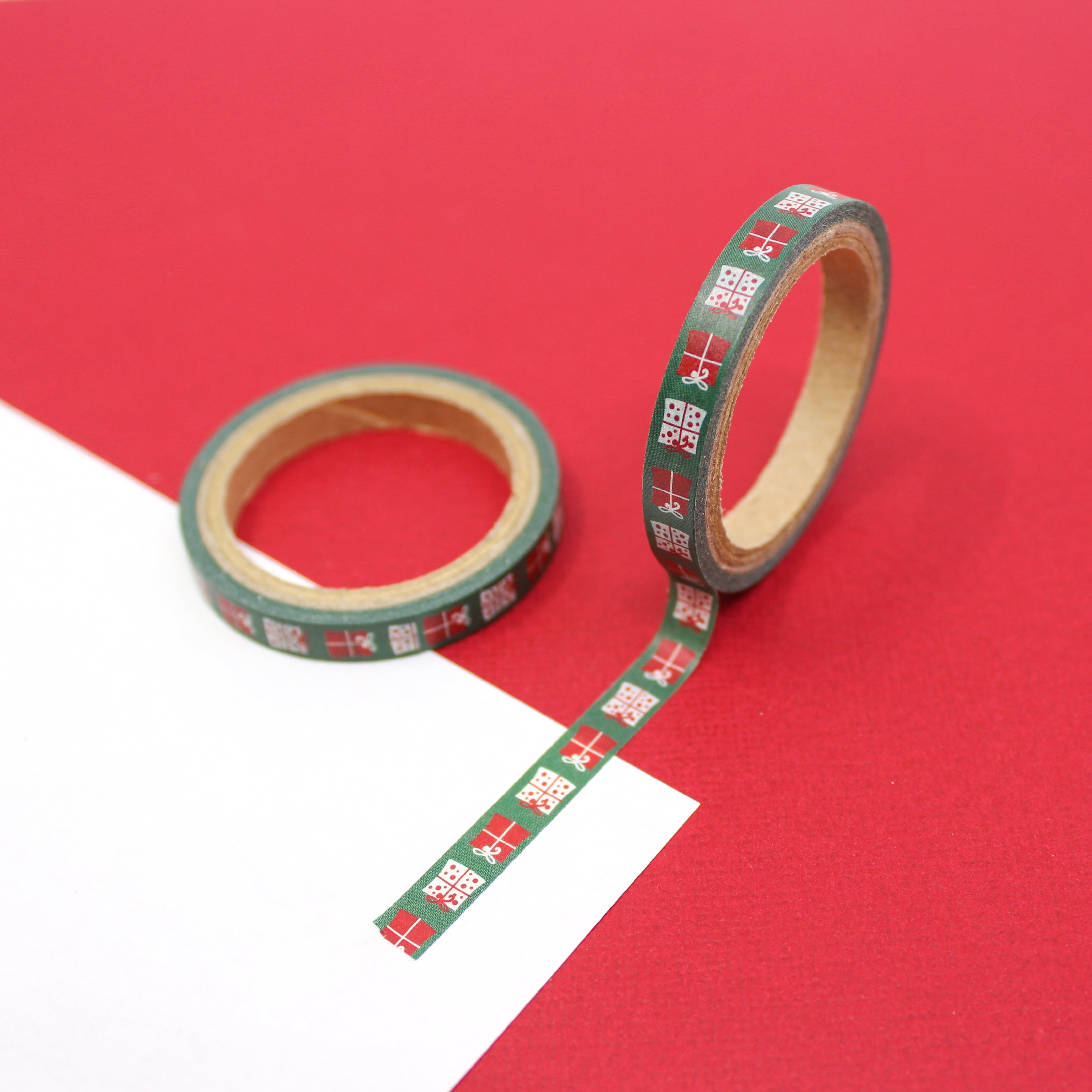 Infuse your creations with the spirit of giving using our washi tape adorned with green Christmas gifts, capturing the joy and excitement of holiday presents. This tape is sold at BBB Supplies Craft Shop.