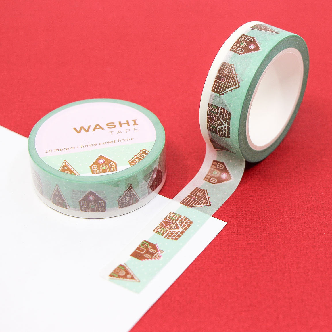 Holiday-themed washi tape roll with cozy gingerbread houses — aesthetic planner and journaling tape.