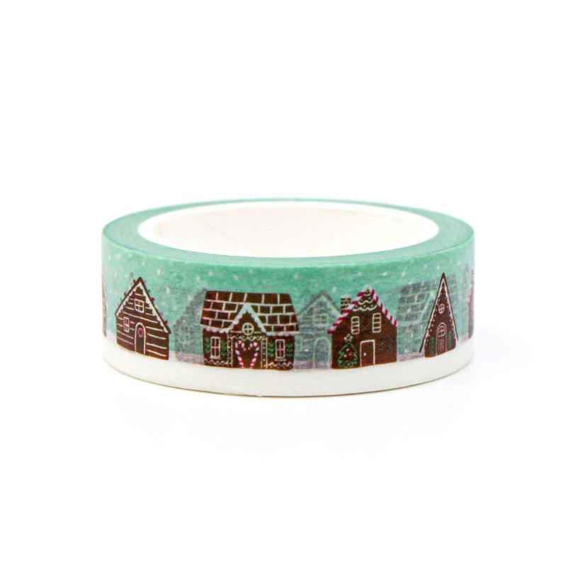 Christmas washi tape roll with gingerbread house pattern for planners, crafts, and stationery lovers.