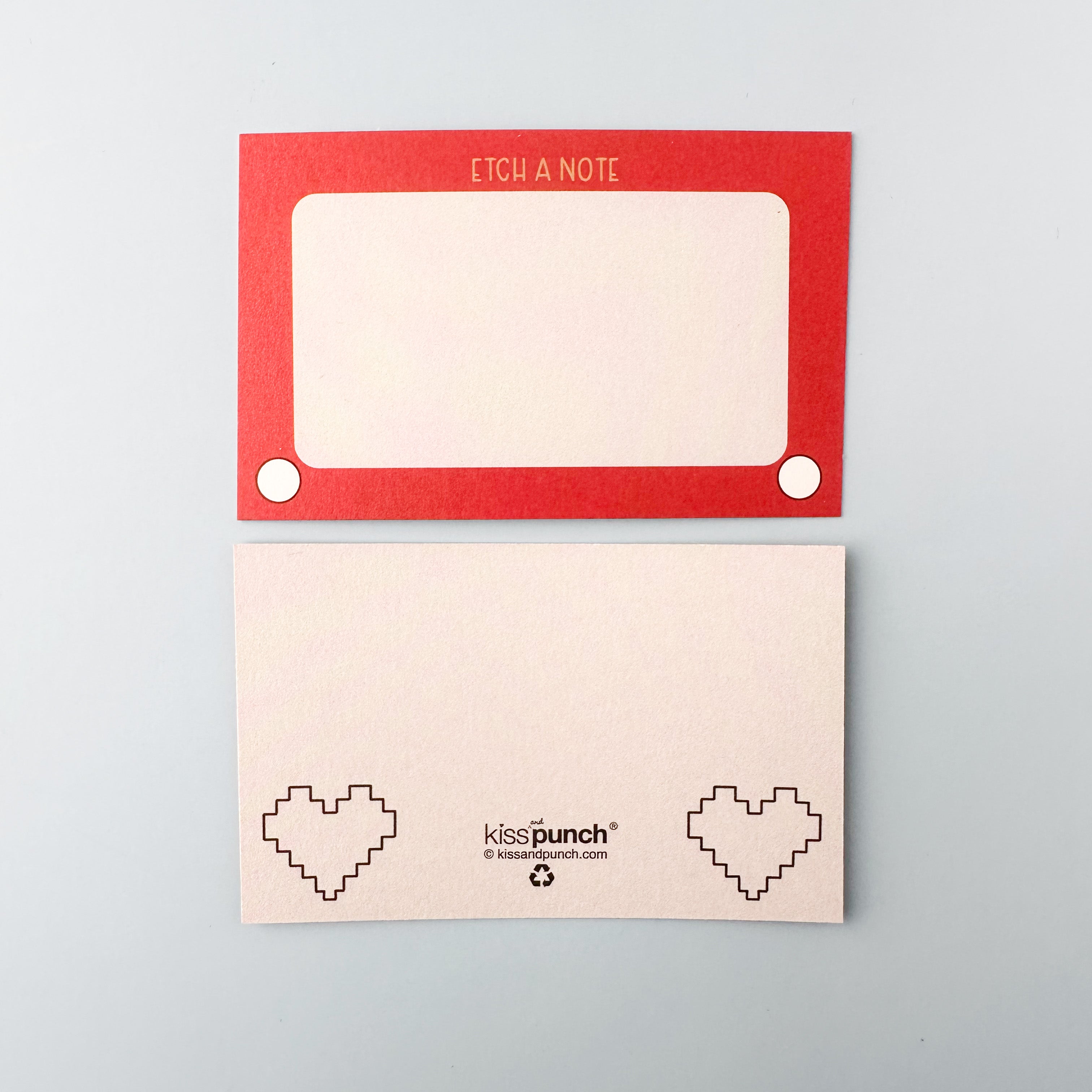 Rediscover nostalgia with our Etch a Sketch Mini Notecards, featuring charming illustrations inspired by the classic toy. Ideal for adding a playful and retro touch to your notes and messages. These notecards from Kiss Punch are sold at BBB Supplies Craft Shop.