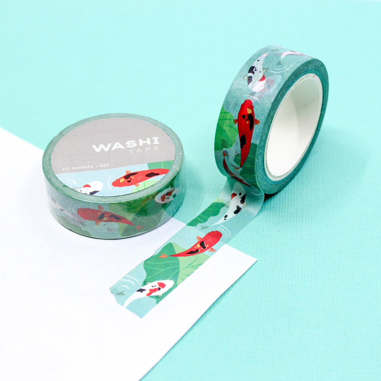 Koi Fish Washi Tape, featuring vibrant and graceful koi swimming in a watercolor-inspired aquatic scene, adding a touch of elegance and serenity to your creative projects. This tape is from Girl of All Work aned Sold at BBB Supplies Craft Shop.