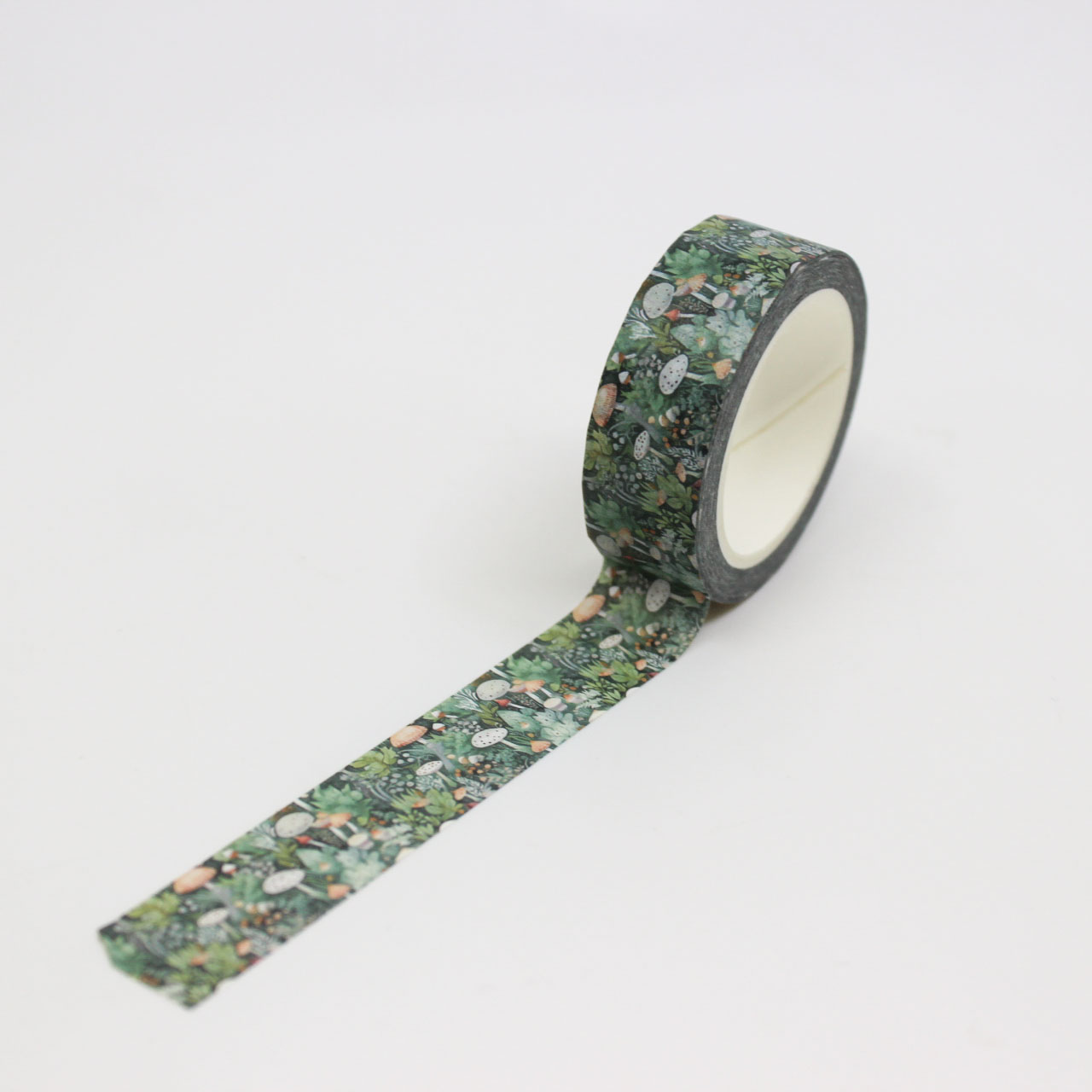 Enchant your projects with this whimsical washi tape featuring a mystical forest scene of mushrooms and foliage, ideal for nature-themed crafts and journals. This tape is sold at BBB Supplies Craft Shop.