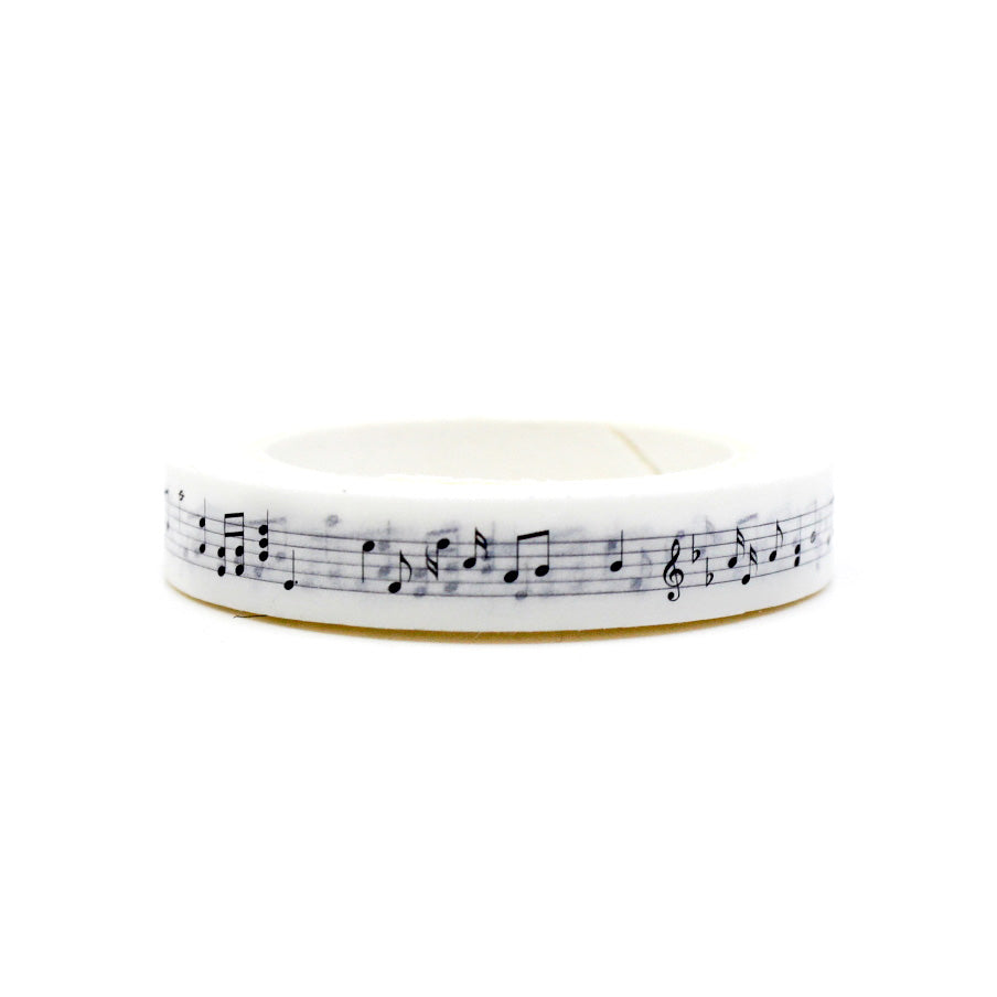 Enhance your crafts with our Slim White Music Notes Washi Tape, featuring a delicate pattern of musical notes in white. Perfect for adding a musical and artistic touch to your projects. This tape is sold at BBB Supplies Craft Shop.