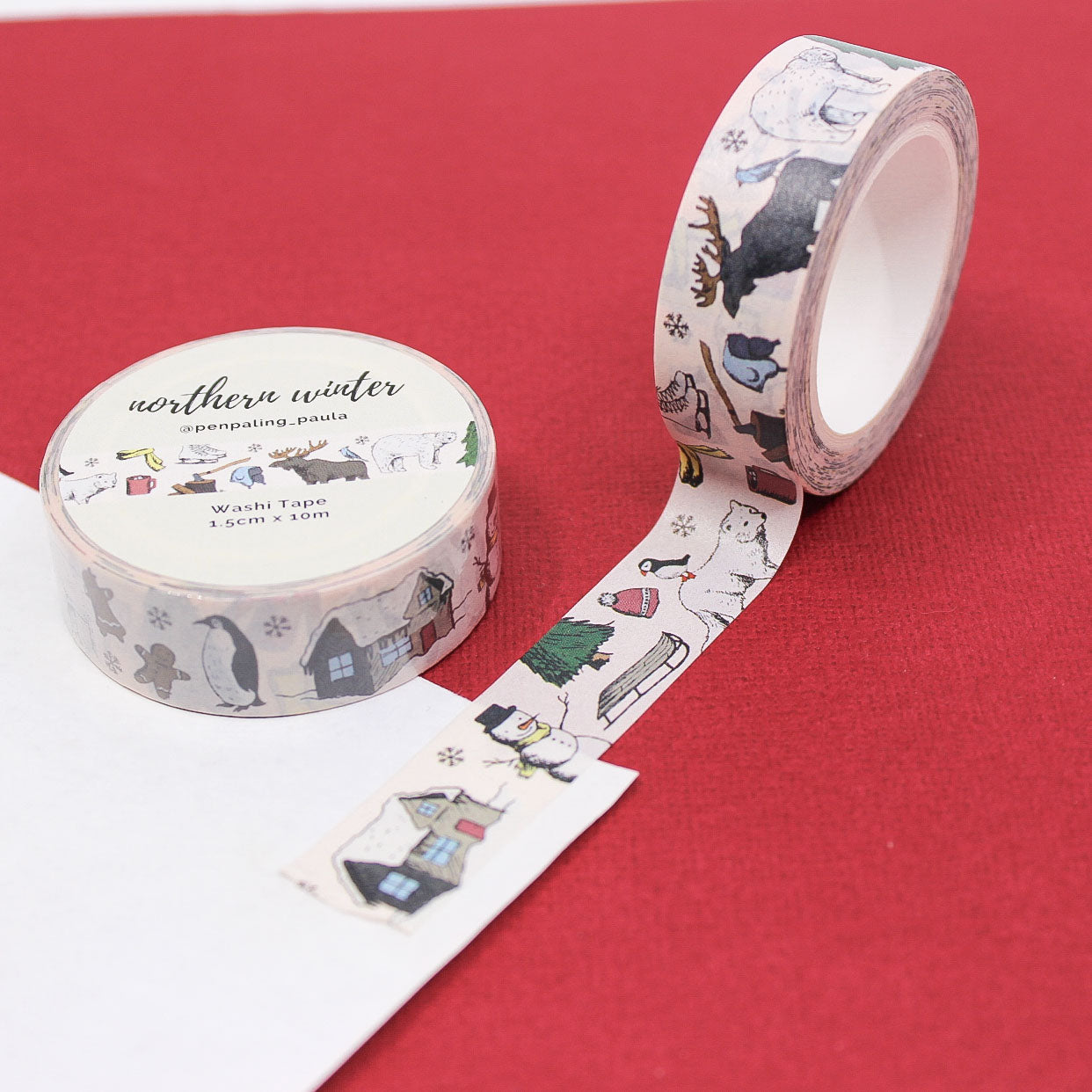 Northern Winter Washi Tape featuring polar bears, penguins, moose, and cozy cabins — whimsical winter journaling tape.