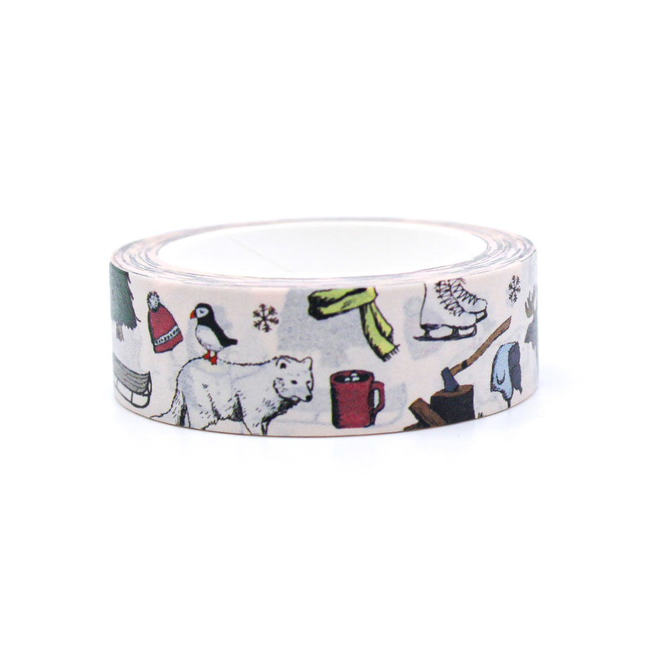 Cute Christmas washi tape roll with snowy woodland animals and cabins, perfect for planners and holiday crafts.