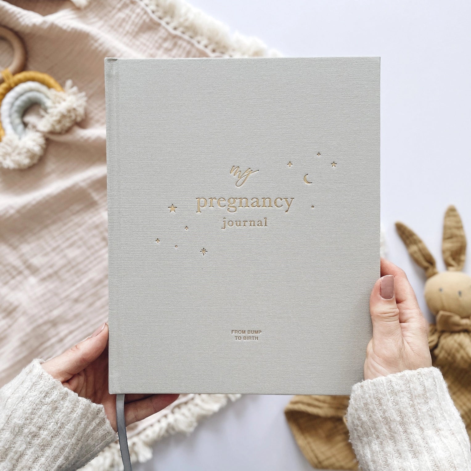 Pregnancy Planner with sections for baby tracking, doctor appointments, trimester goals, baby name ideas, nursery planning, and birth plan preparation.