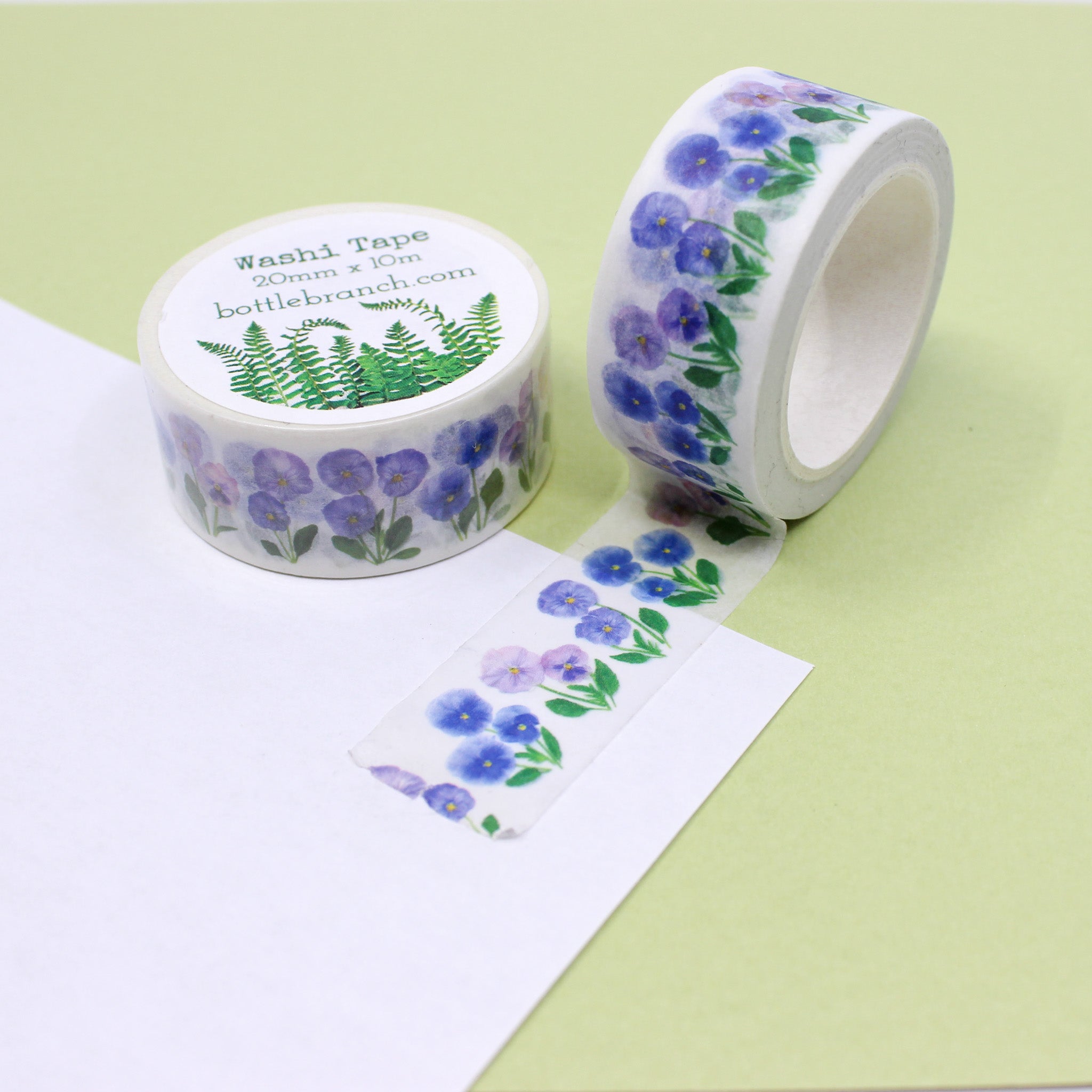 Adorn your projects with the charm of purple pansies using our exquisite purple pansy washi tape, showcasing delicate and vibrant floral patterns and Elevate your crafts with our captivating purple pansy washi tape. This tape is designed by Bottle Branch and sold at BBB Supplies Craft Shop.