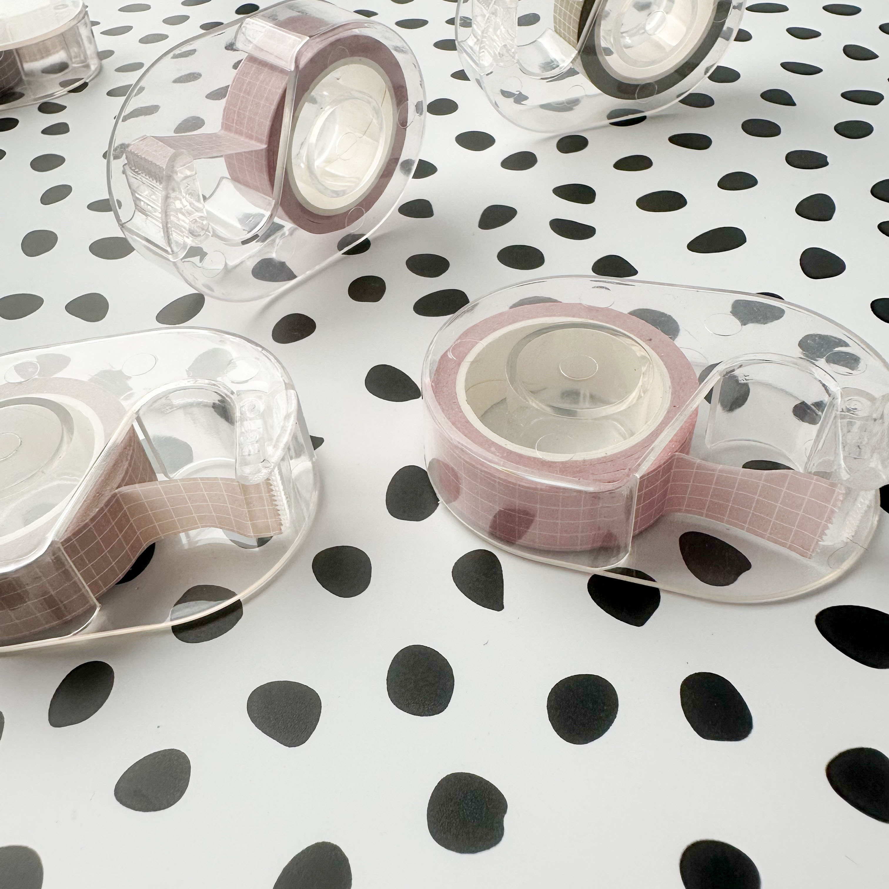 Clear plastic washi tape cutter designed for one standard roll