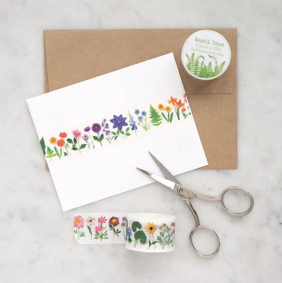 Add a burst of color to your crafts with our vibrant rainbow floral washi tape, featuring a variety of flowers in a spectrum of vibrant hues. Embrace the beauty of nature's palette with our rainbow floral washi tape. This tape is designed by Bottle Branch and sold at BBB Supplies Craft Shop.