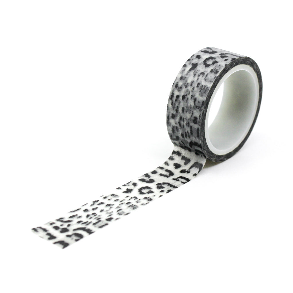 A close-up photo of snow leopard pattern washi tape. The tape features a white background with intricate black spots resembling the distinctive markings of a snow leopard. The pattern exudes elegance and captures the beauty of this majestic big cat. This tape is sold exclusively at BBB Supplies Craft Shop.