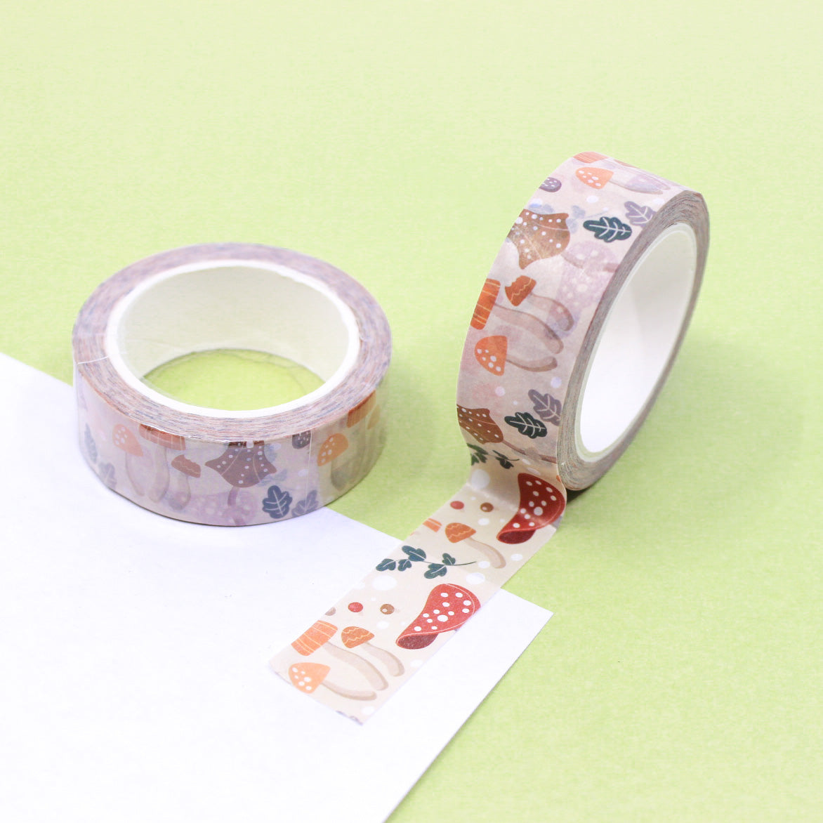 Add a natural touch to your projects with this washi tape featuring a pattern of tan mushrooms. Perfect for nature-themed crafts, scrapbooking, or adding a rustic flair to your journal pages. This tape is sold at BBB Supplies Craft Shop.