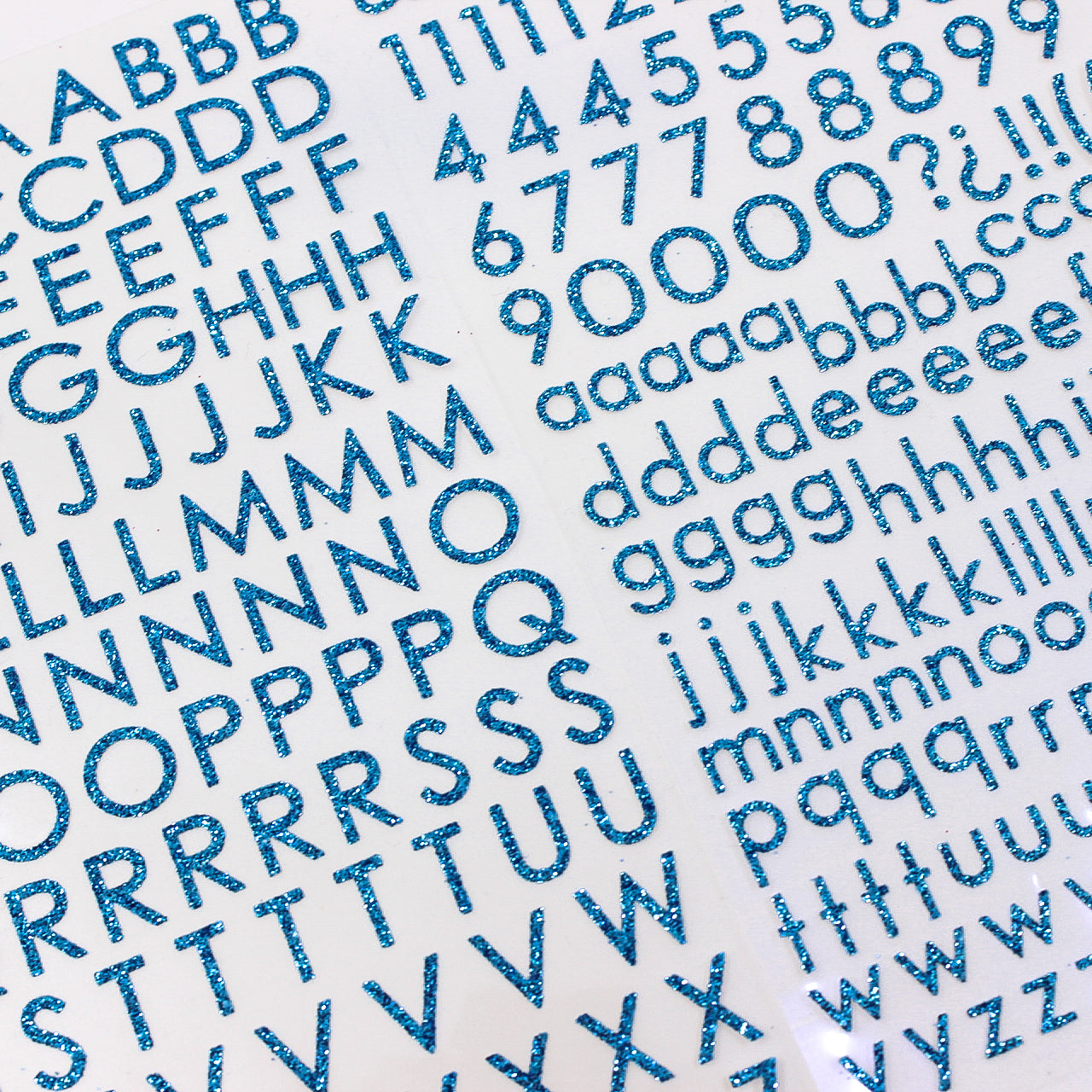 Add sparkle to your crafts with our glitter turquoise blue color letter stickers, featuring a shimmering assortment of letters in a vibrant spectrum of colors. These sticker sheets are sold at BBB Supplies Craft Shop.