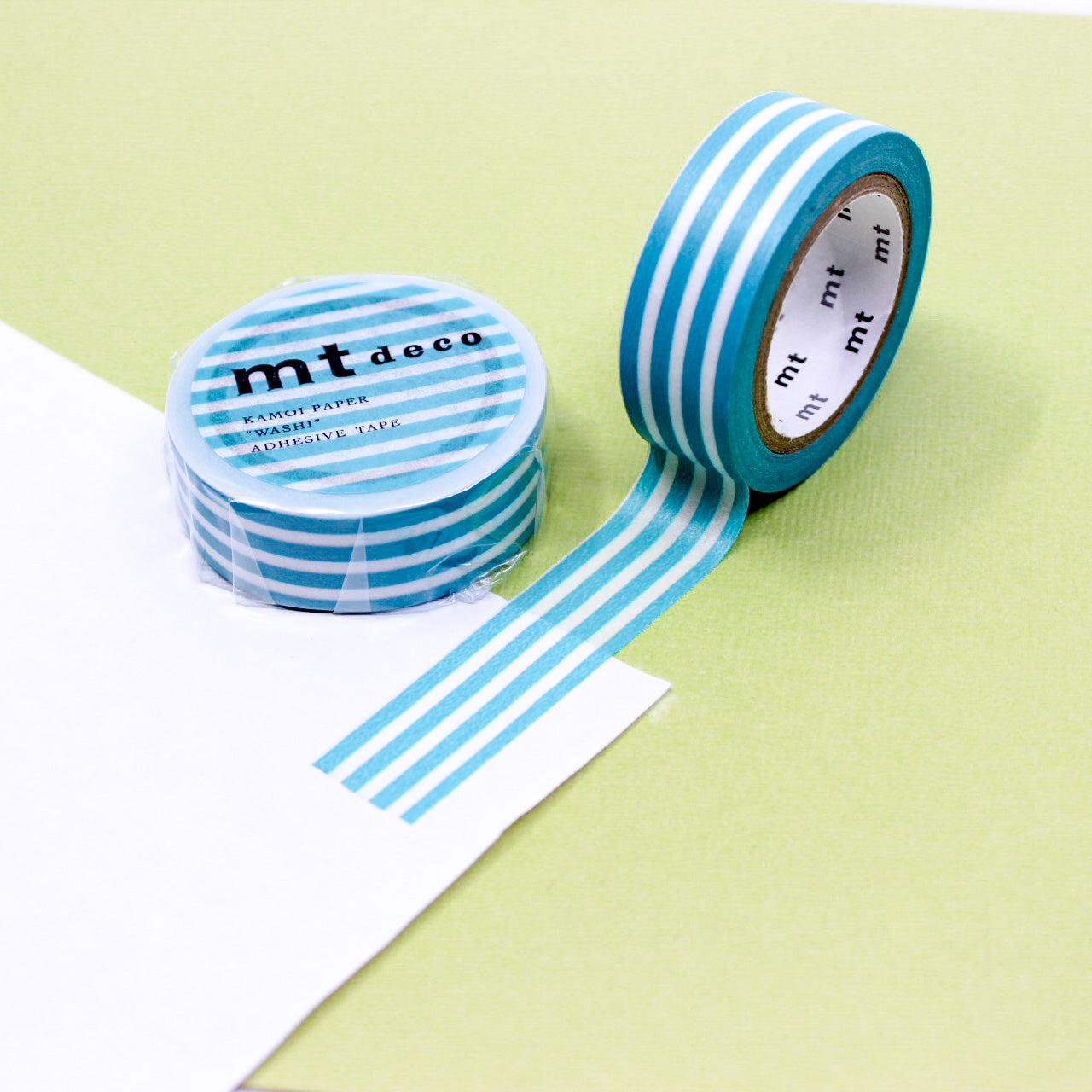 Enhance your crafts with our thicker line horizontal stripe washi tape, featuring bold and stylish stripes in a variety of colors, perfect for adding a dynamic and vibrant element to your projects. This Turquoise Stripe tape is from MT Brand Masking Tape and sold at BBB Supplies Craft Shop.
