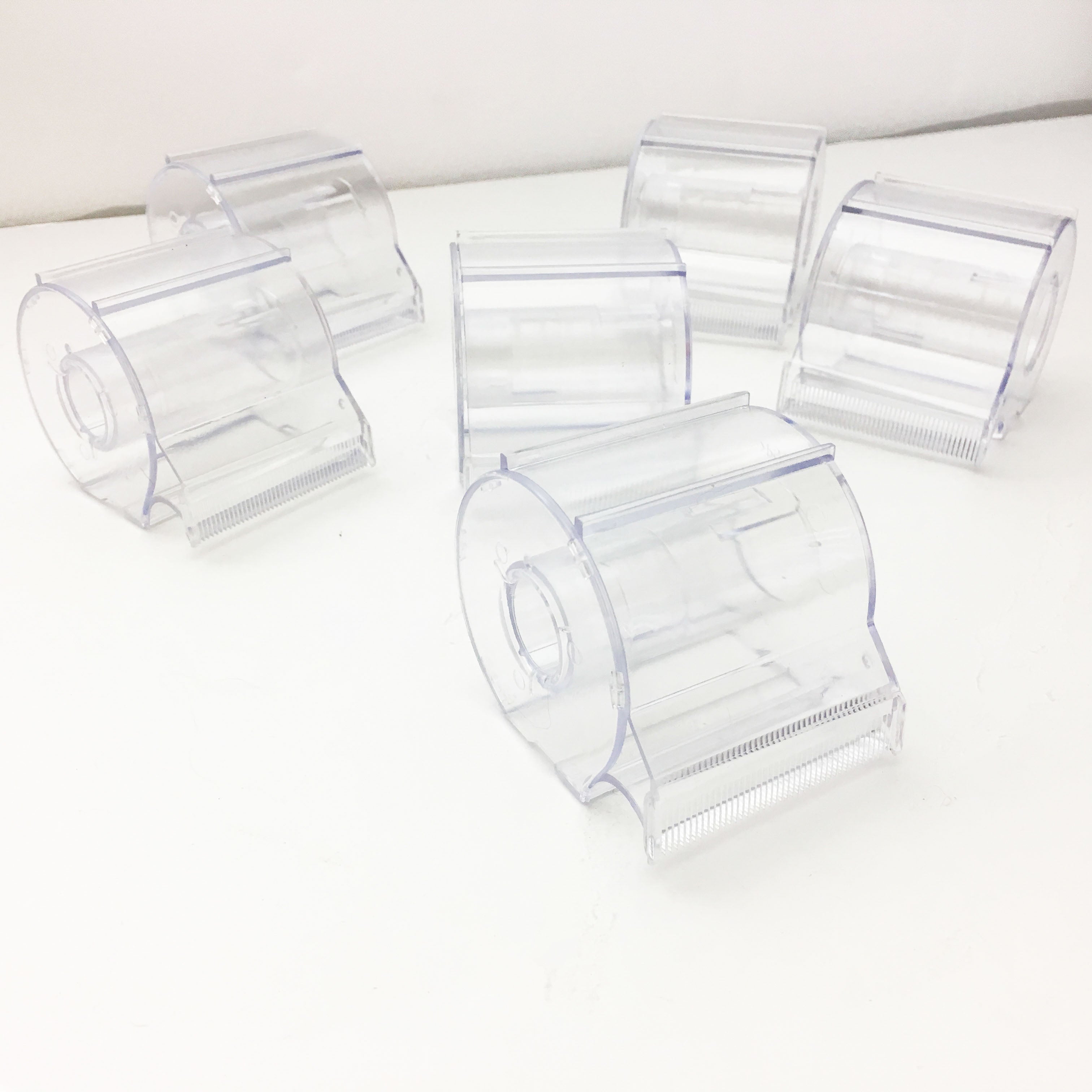 side view of Clear plastic washi tape dispenser with serrated edge for easy cutting