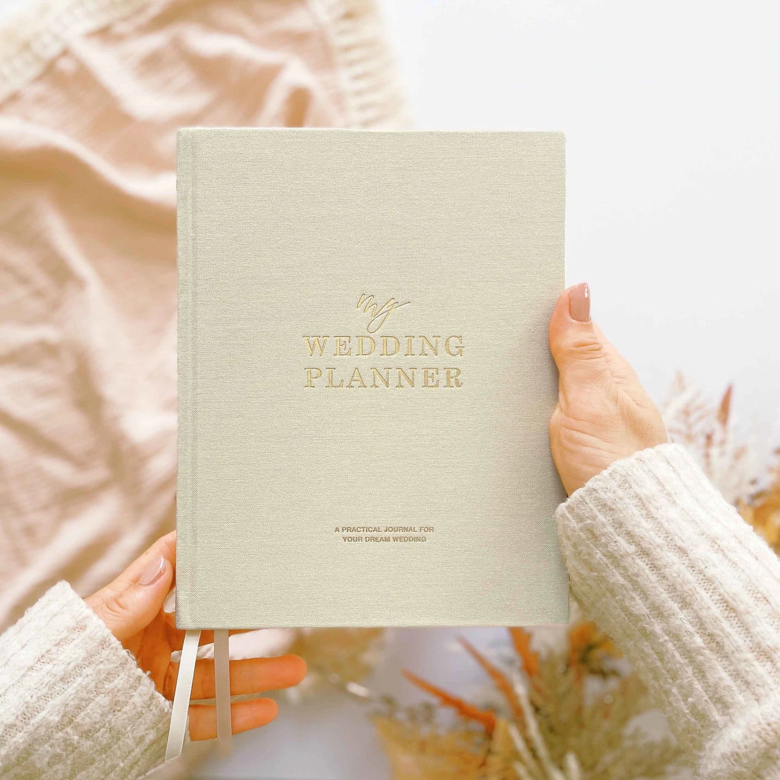 Ivory Wedding Planner featuring sections for budgeting, guest lists, venue selection, vendor coordination, and wedding timelines for stress-free planning.