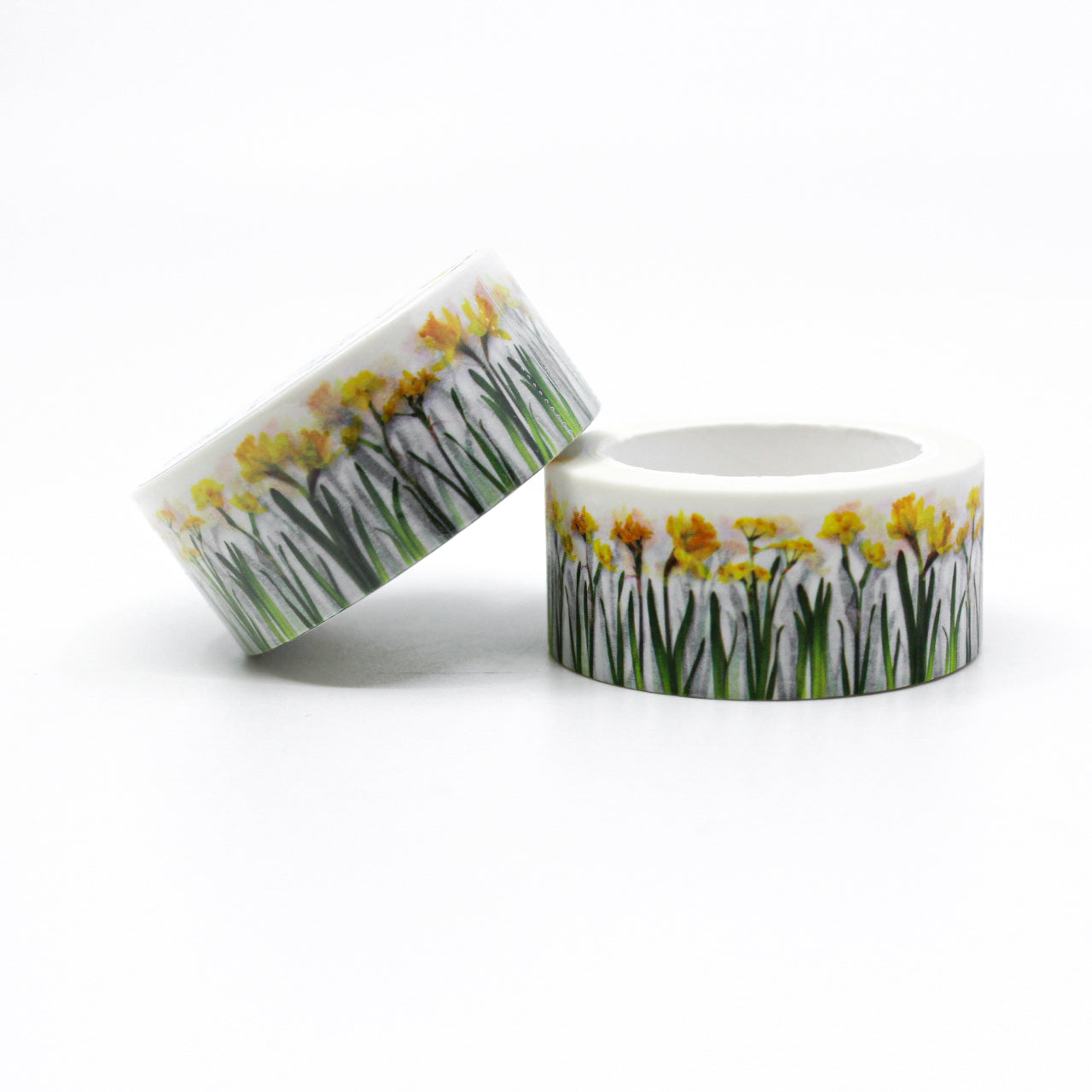 Add a touch of sunshine to your projects with our vibrant yellow daffodil washi tape, featuring cheerful daffodil blooms in shades of yellow. our delightful yellow daffodil washi tape, adorned with beautiful daffodil flower patterns that radiate warmth and joy. This tape is designed by Bottle Branch and sold at BBB Supplies Craft Shop.
