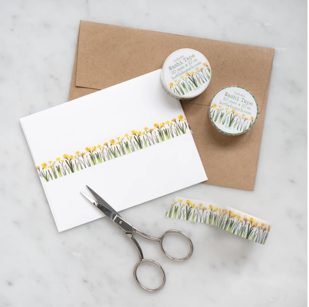 Add a touch of sunshine to your projects with our vibrant yellow daffodil washi tape, featuring cheerful daffodil blooms in shades of yellow. our delightful yellow daffodil washi tape, adorned with beautiful daffodil flower patterns that radiate warmth and joy. This tape is designed by Bottle Branch and sold at BBB Supplies Craft Shop.