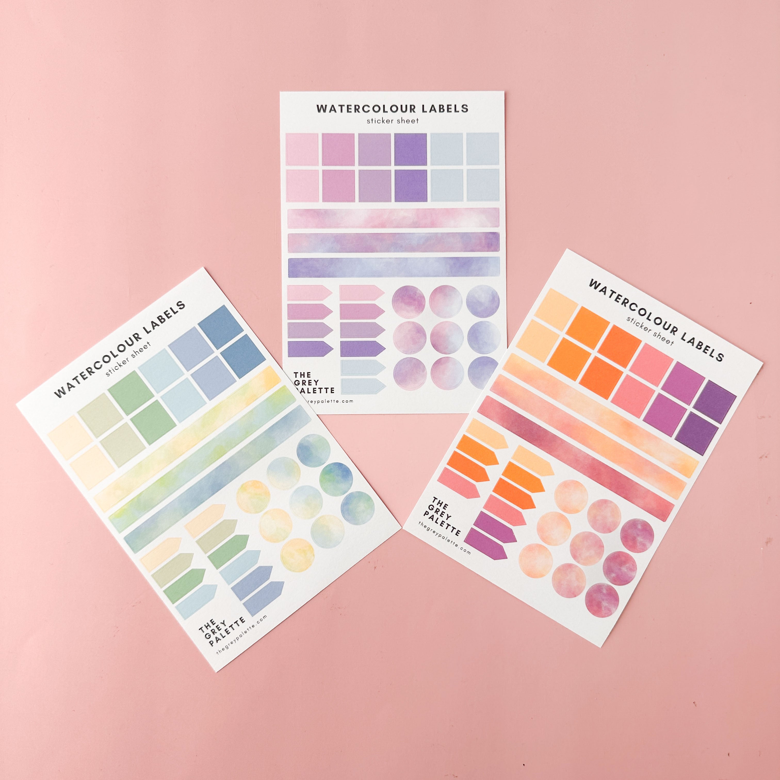 This is the three colorways of Watercolor planner sticker sheets with assorted labels in square, rectangle, arrow, and circle shapes in soft, pastel tones.