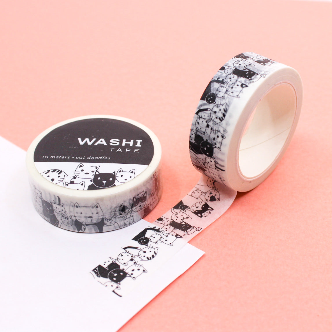 Black & White Cat Doodles Washi Tape featuring playful hand-drawn cat sketches in black on a white background, perfect for adding a whimsical and cute touch to planners, journals, and crafts
