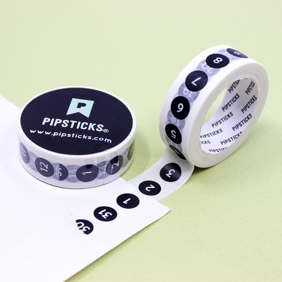 Black and white numbered circle washi tape used to create a minimalist to-do list in a planner.