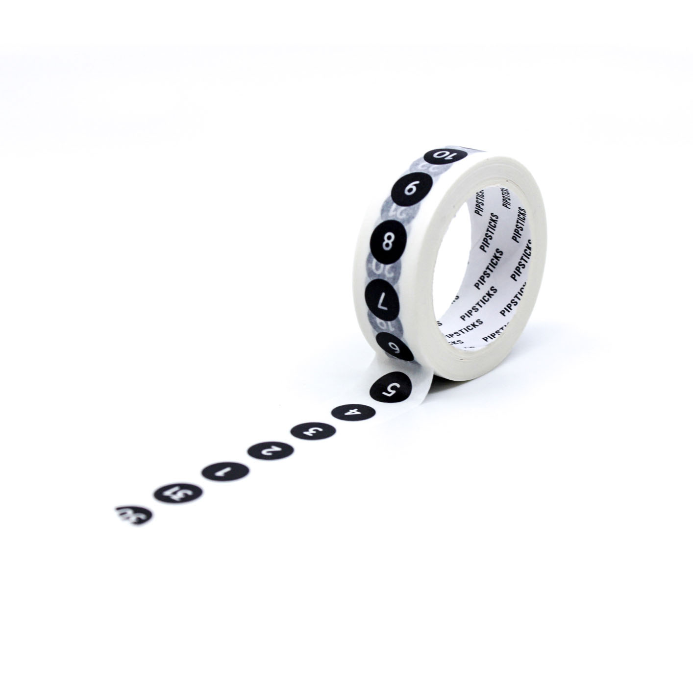 Close-up of numbers 1–31 on black circular washi tape for bullet journaling and organization.
