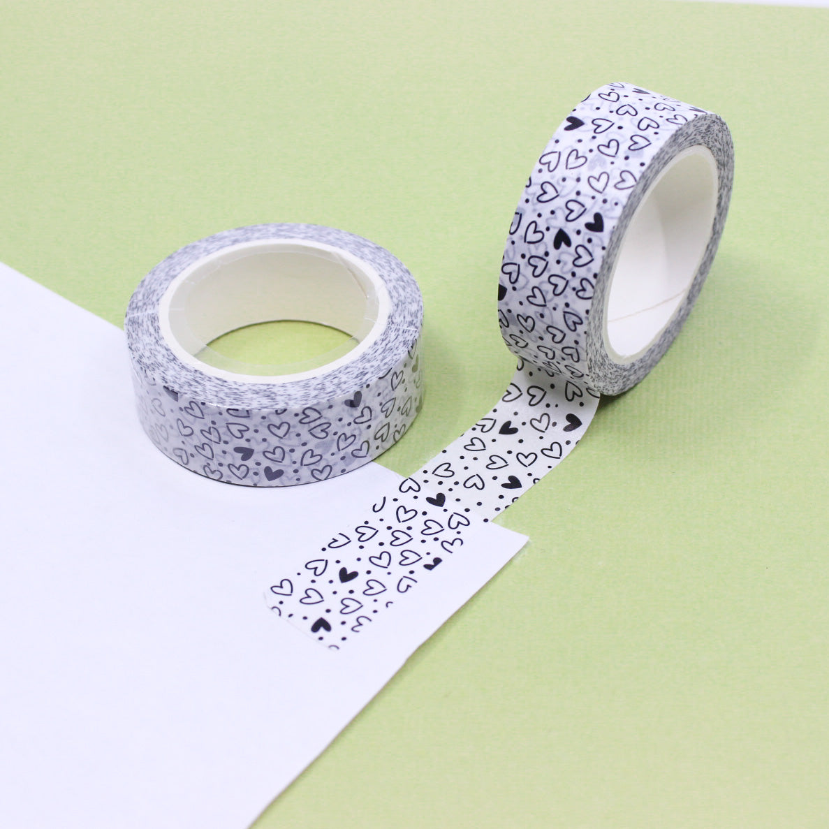 Add a playful touch to your crafts with this fun and modern black and white hearts washi tape. Featuring a stylish heart pattern, this tape is perfect for adding a pop of pattern to your projects. Use it to decorate scrapbook pages, greeting cards, and more! This tape is sold at BBB Supplies Craft Shop.