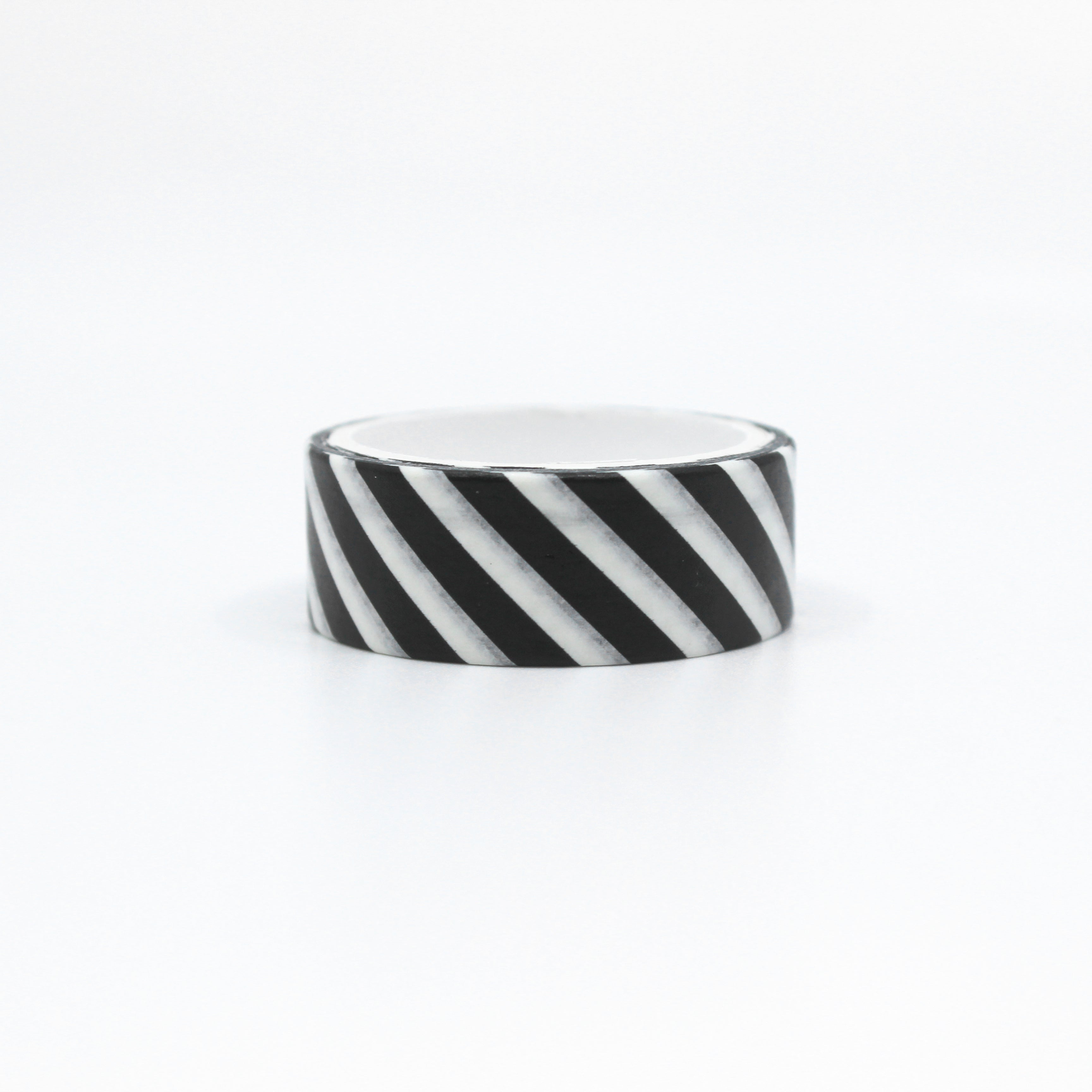 Add a touch of modern sophistication with our black and white striped washi tape, featuring a sleek and stylish pattern of diagonal stripes. This tape is sold at BBB Supplies Craft Shop.