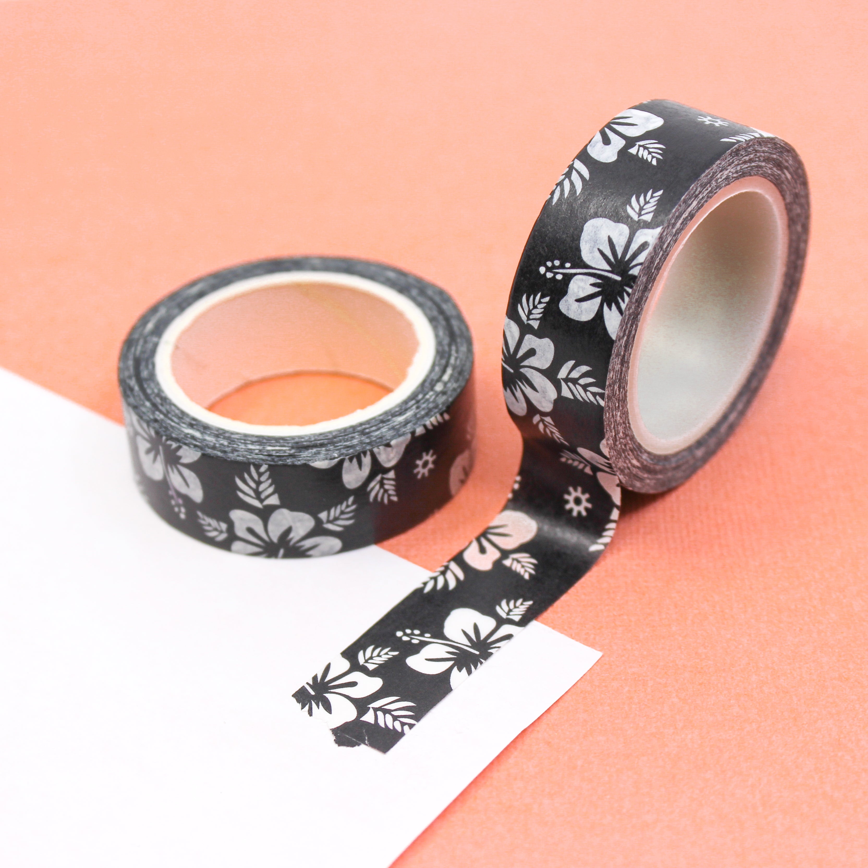 Infuse your crafts with a touch of tropical allure using our black and white tropical hibiscus pattern floral washi tape, featuring exquisite hibiscus flowers in a striking black and white color scheme. This tape is sold at BBB Supplies Craft Shop.