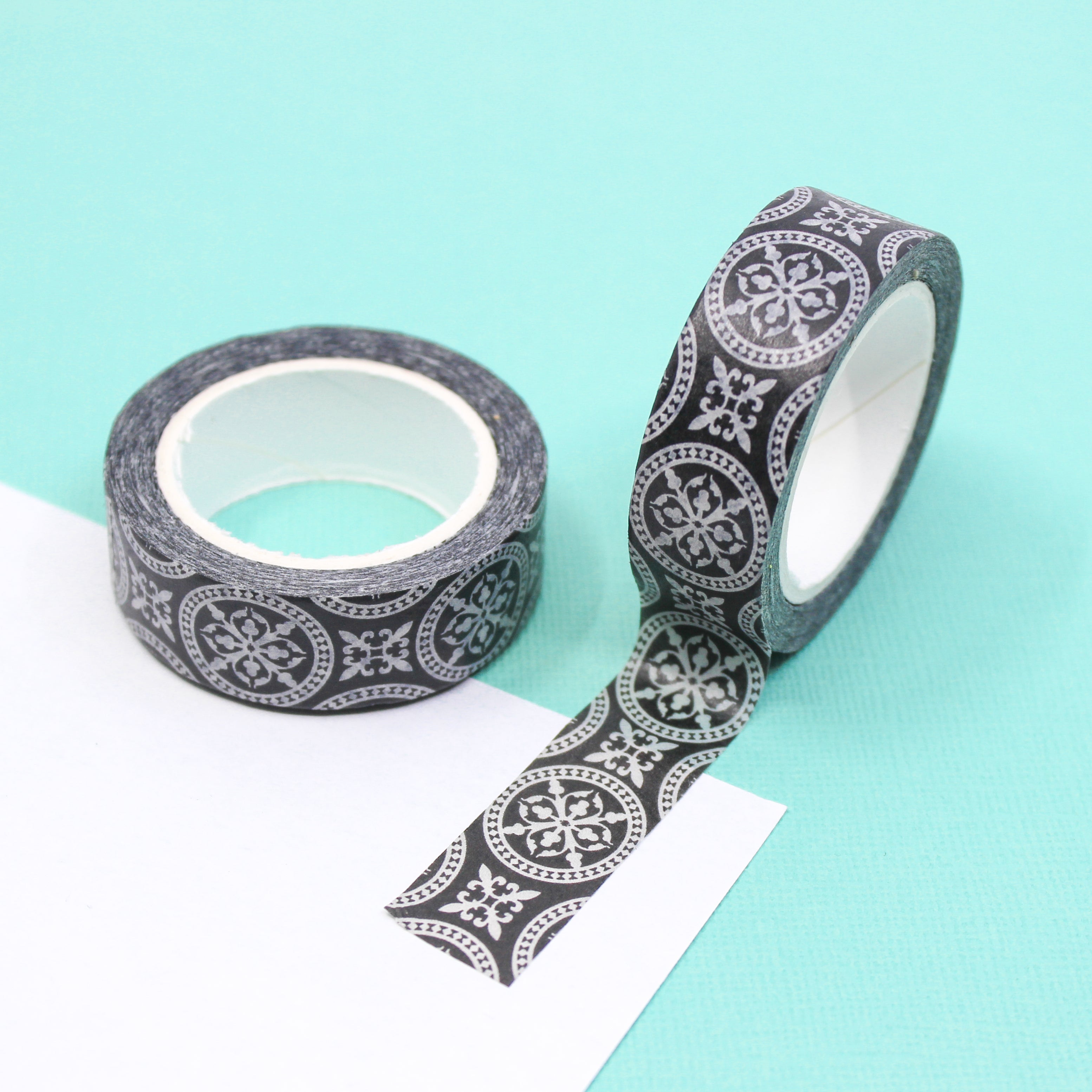 Add a touch of elegance to your crafts with our black and white medallion round repeat pattern washi tape, featuring a captivating and intricate design of repeating medallions in a classic black and white color scheme. This tape is sold at BBB Supplies Craft Shop.