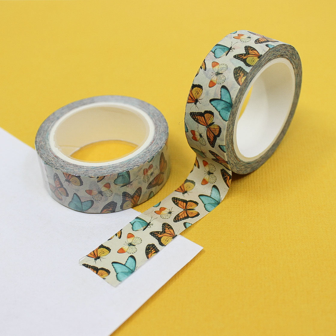 This bright and colorful washi tape features delicate Blue and orange butterflies, perfect for adding a whimsical touch to your crafts and journals. This tape is sold at BBB Supplies Craft Shop.