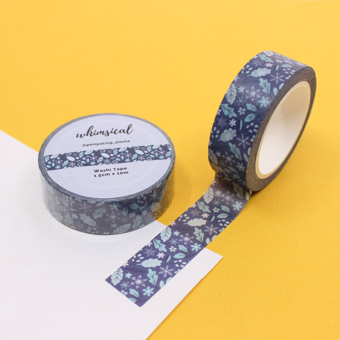 Blue Winter Leaves and Snowflakes Washi Tape featuring delicate leaf and snowflake patterns, ideal for adding a wintry touch to your holiday creations. This tape is from Penpaling Paula and sold at BBB Supplies Craft Shop.