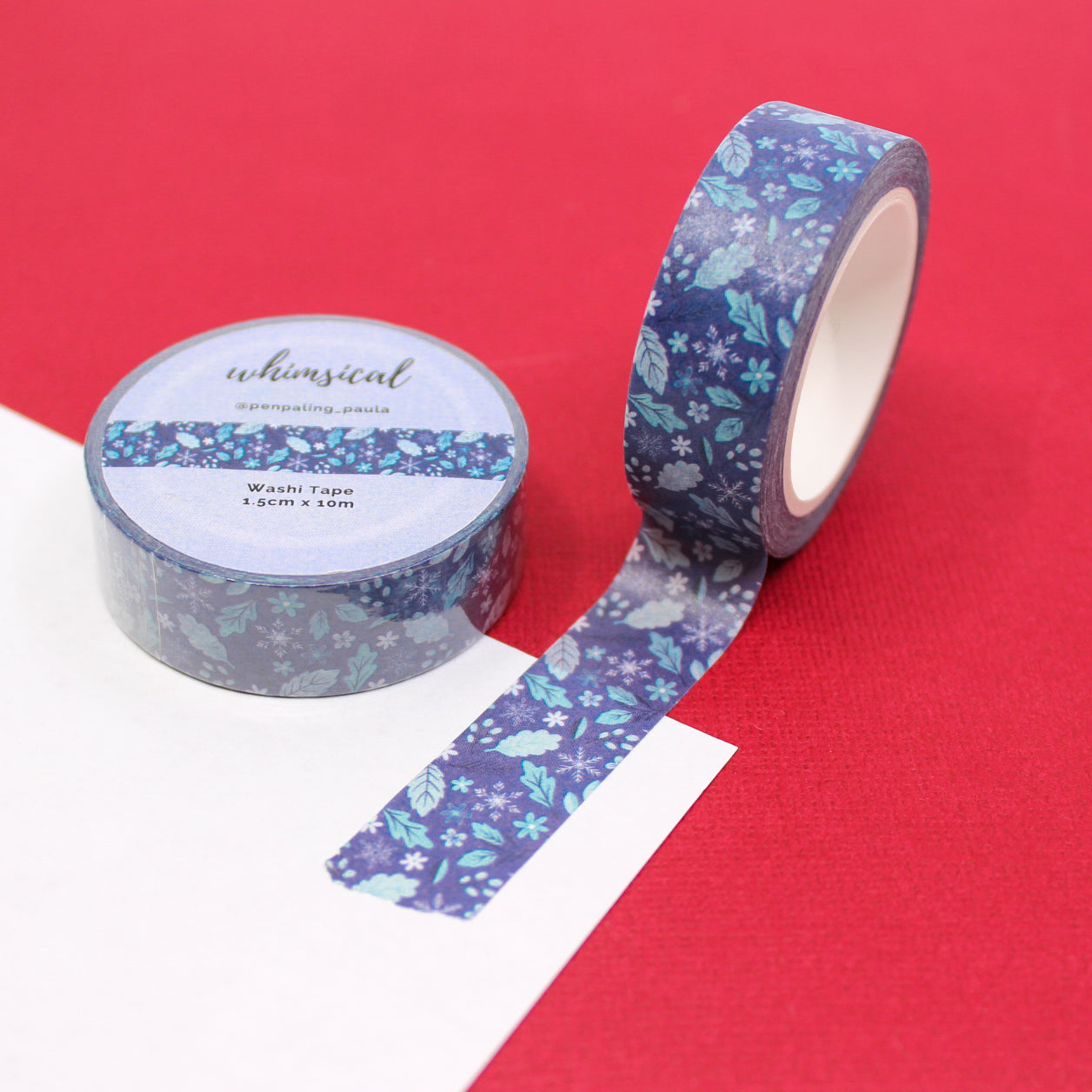 Blue Winter Leaves and Snowflakes Washi Tape featuring delicate leaf and snowflake patterns, ideal for adding a wintry touch to your holiday creations. This tape is from Penpaling Paula and sold at BBB Supplies Craft Shop.