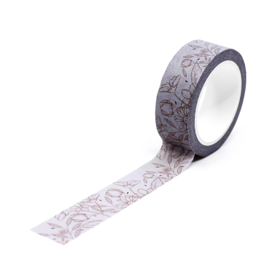 Add a subtle floral touch to your crafts with this elegant neutral linea floral washi tape. Perfect for adding a sophisticated accent to your journals, scrapbooks, and other projects. This tape is sold at BBB Supplies Craft Shop.