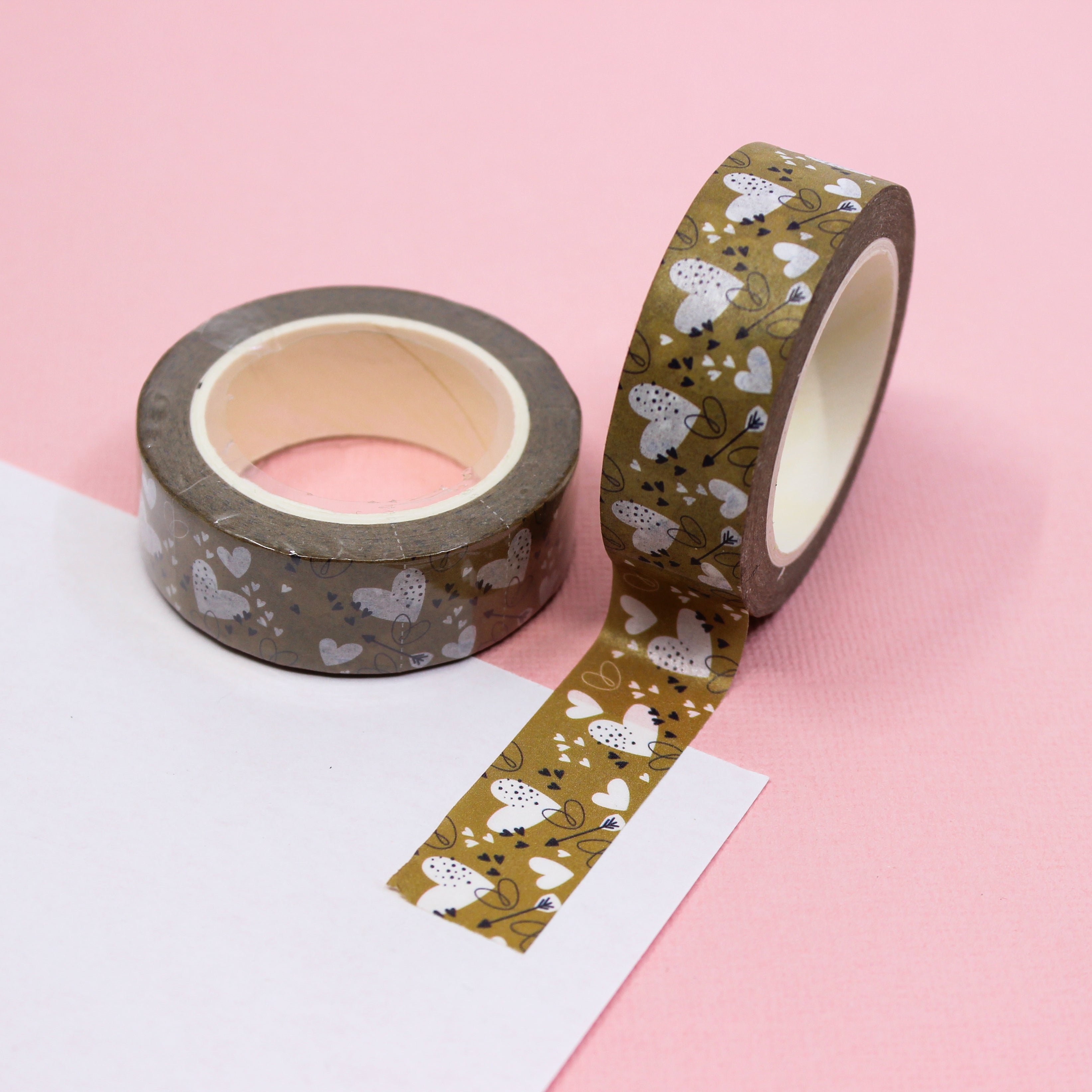 Elevate your crafts with this neutral color Valentine Hearts Washi Tape. This tape features a heart and arrow motif. This pattern is sold at BBB Supplies Craft Shop.