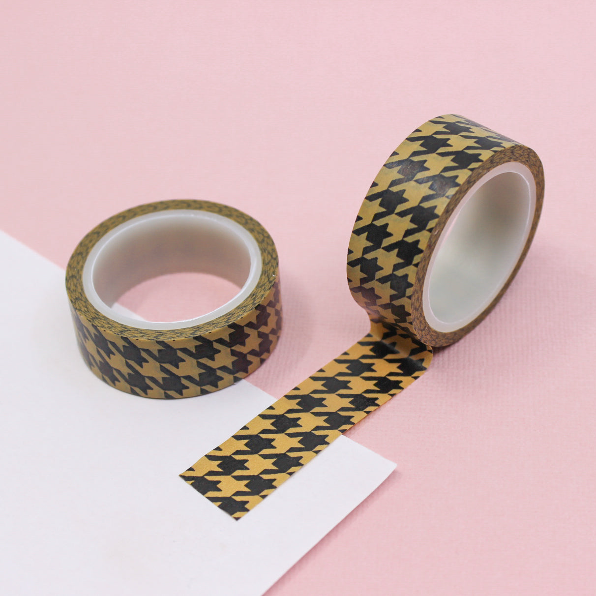 A close-up photo of Warm Brown Houndstooth Pattern Washi Tape. The tape features a classic houndstooth design in warm brown tones. The intricate pattern creates a sense of refined elegance, making it a versatile choice for various creative projects. This tape is sold exclusively at BBB Supplies Craft Shop. 