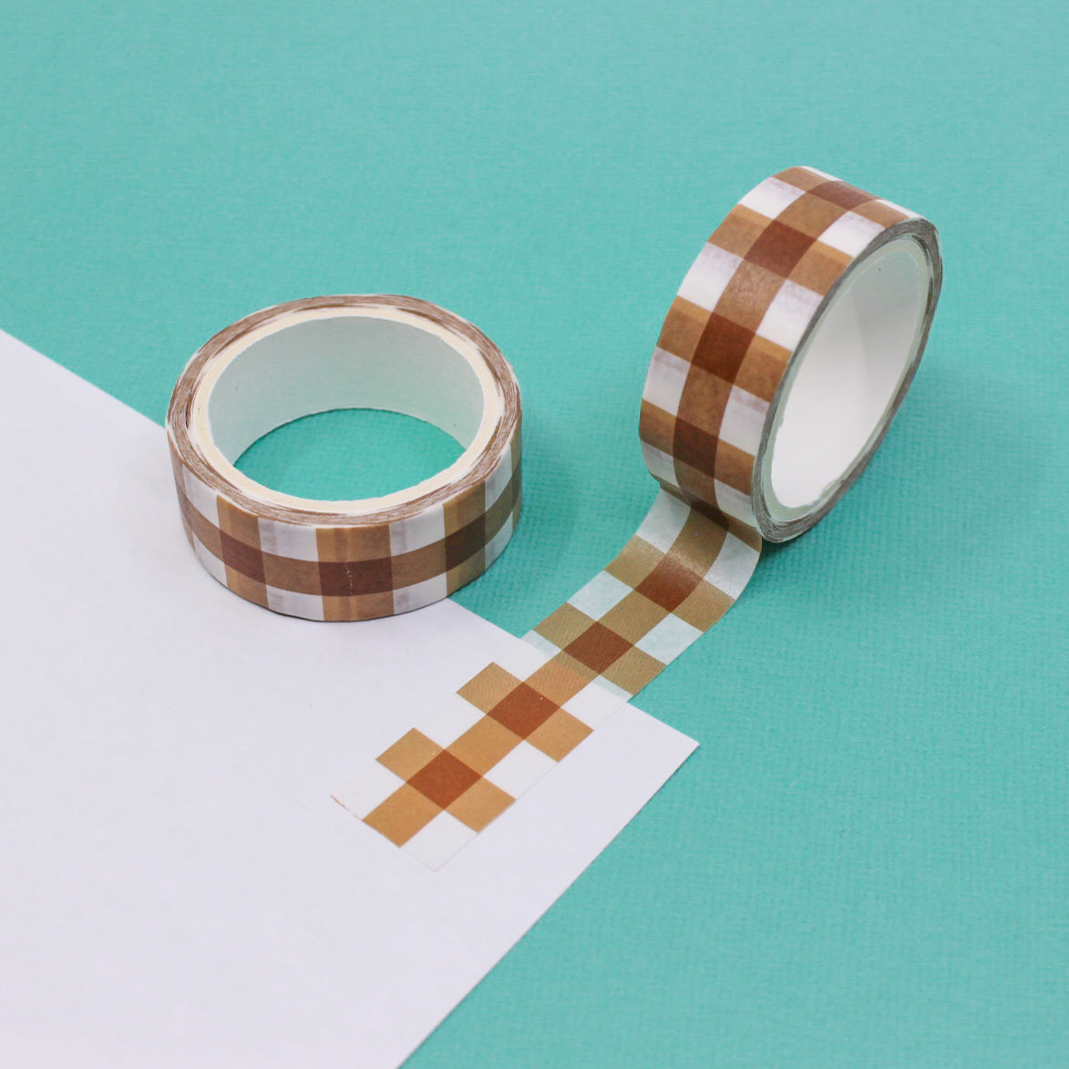 Add a rustic touch to your projects with this brown plaid washi tape. Perfect for scrapbooking, card making, or decorating journals and planners. This washi tape is sold at BBB Supplies Craft Shop.