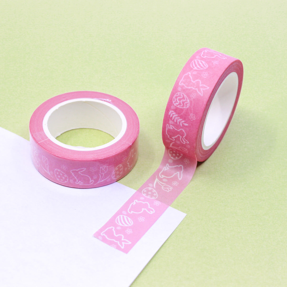 This charming tape features playful bunnies and colorful Easter eggs on a pink background, adding a delightful touch to your Easter crafts and decorations. Perfect for scrapbooking, card-making, and other creative projects. This tape is sold at BBB Supplies Craft Shop.