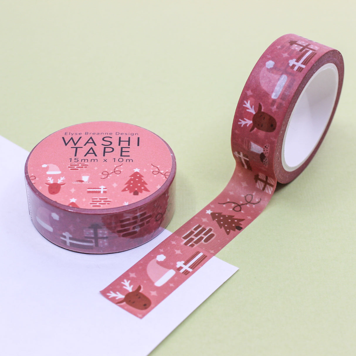 Christmas Chimney Holiday Objects Washi Tape, a delightful tape adorned with festive chimney scenes, stockings, and holiday decorations, adding a cozy and charming touch to your Christmas-themed projects. This tape is from Elyse Breanne Designs and sold at BBB Supplies Craft Shop.