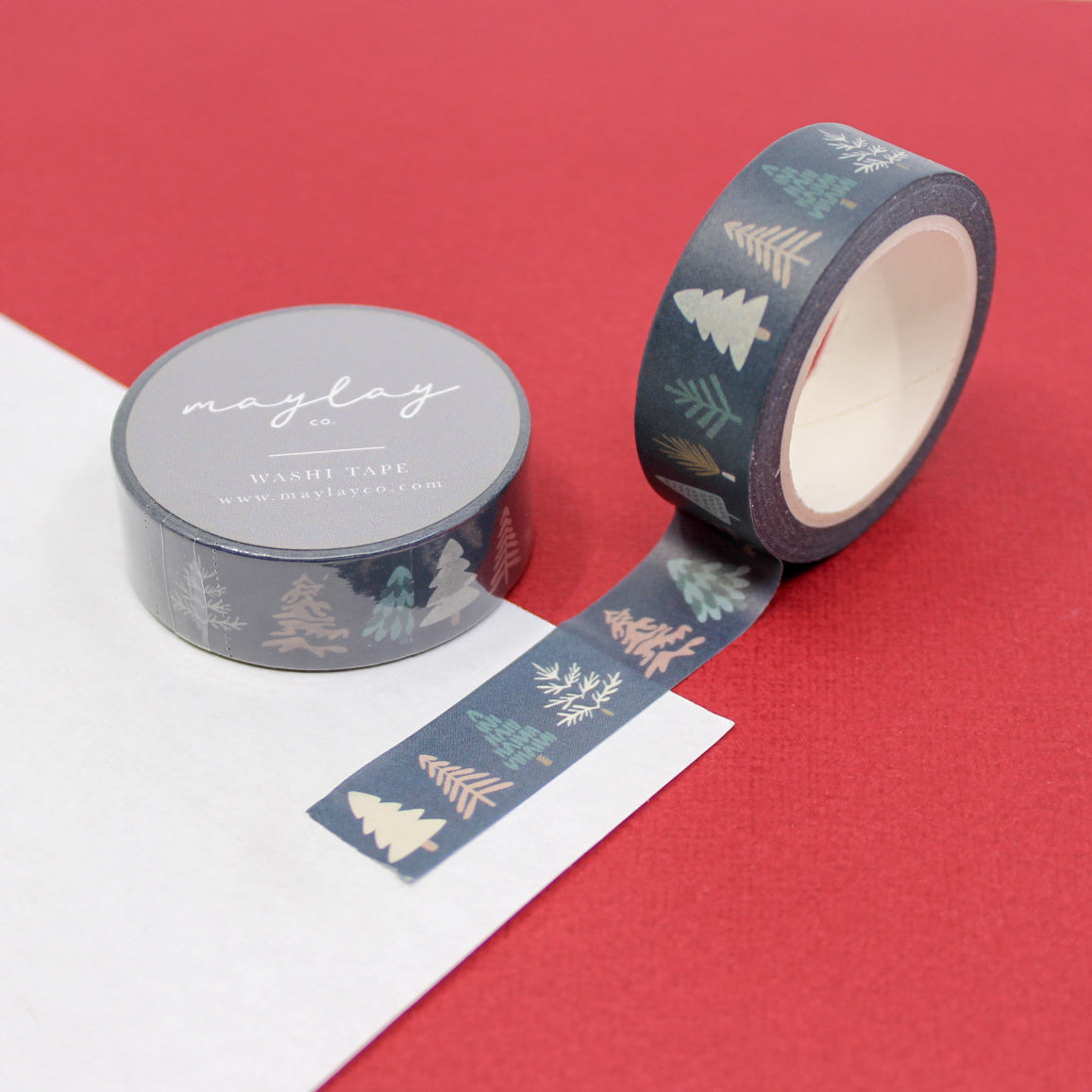 Create a serene holiday ambiance with our Muted Christmas Trees Happy Forest Washi Tape, featuring a peaceful and festive forest of trees. Ideal for adding a touch of Christmas charm to your projects. This tape is from Maylay Co. and sold at BBB Supplies Craft Shop.