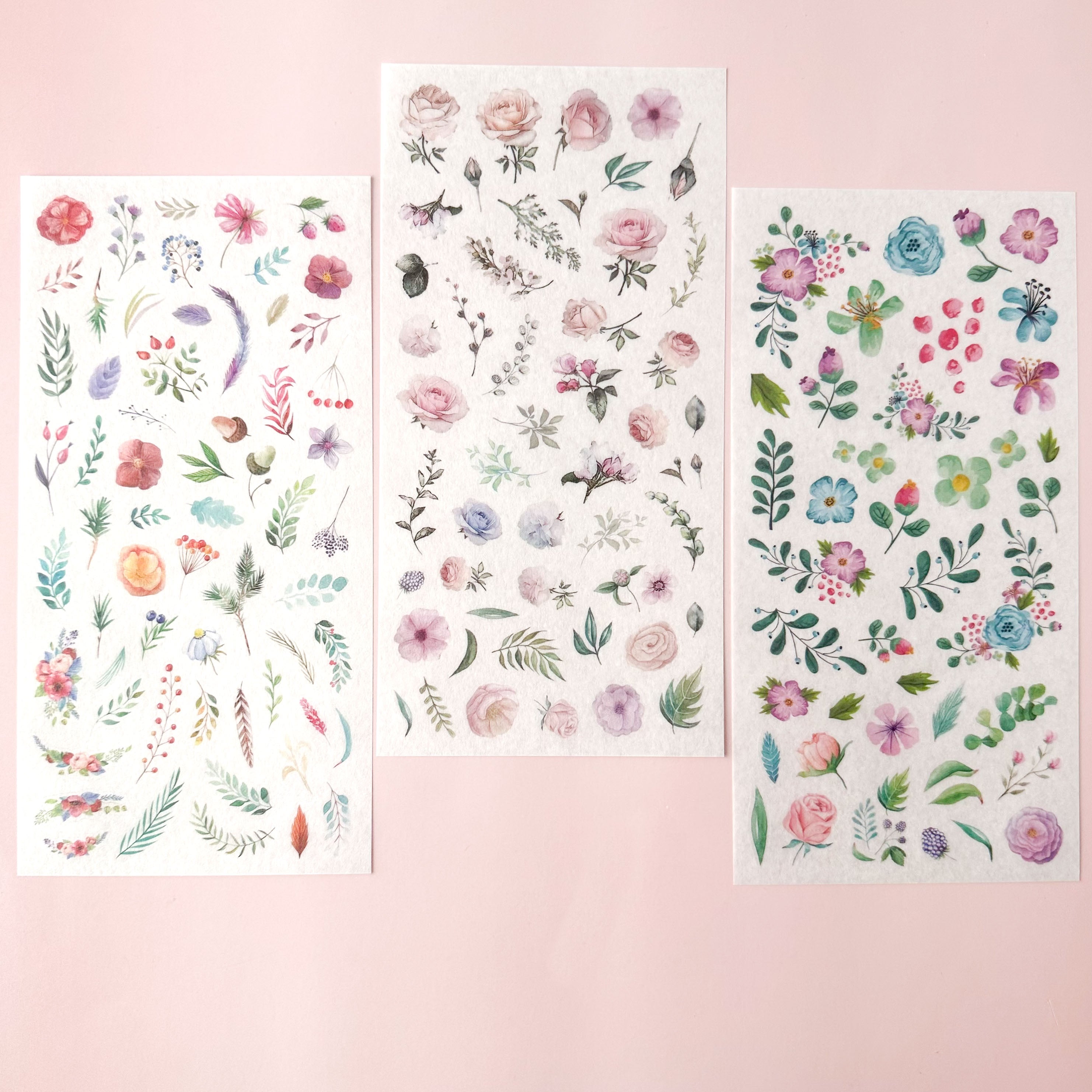 Three sheets of floral stickers on a pink background
