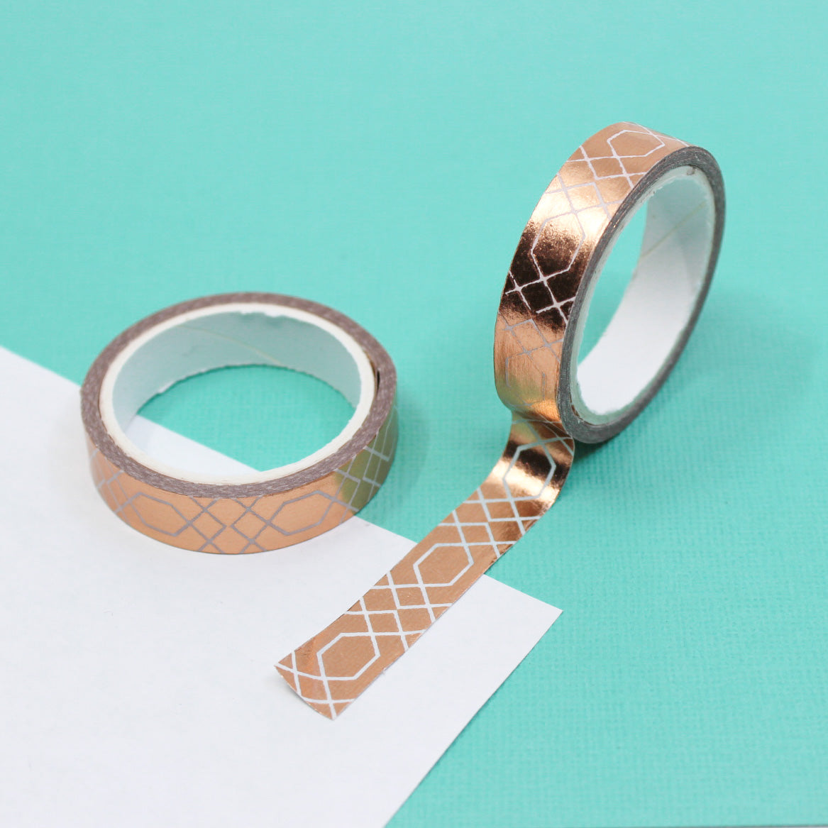 Elevate your crafts with this elegant copper foil washi tape featuring a decorative border scroll design. Perfect for adding a touch of sophistication to your scrapbooking, journaling, or card making projects. This tape is sold at BBB Supplies Craft Shop.