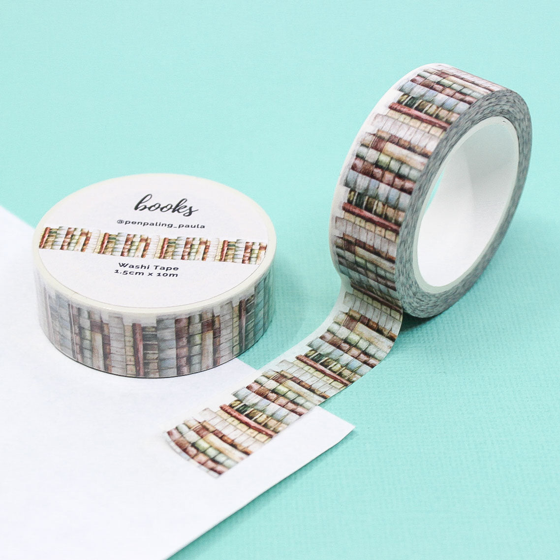 Washi tape with a dreamy book shelf pattern, featuring rows of illustrated books in soft, calming colors for a whimsical, literary-themed design.