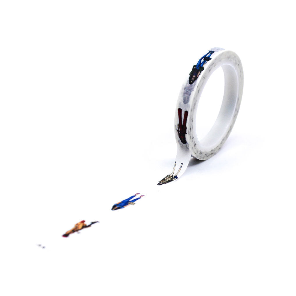 Rolls of character fashion ladies illustration washi tape displayed with strip applied to paper.