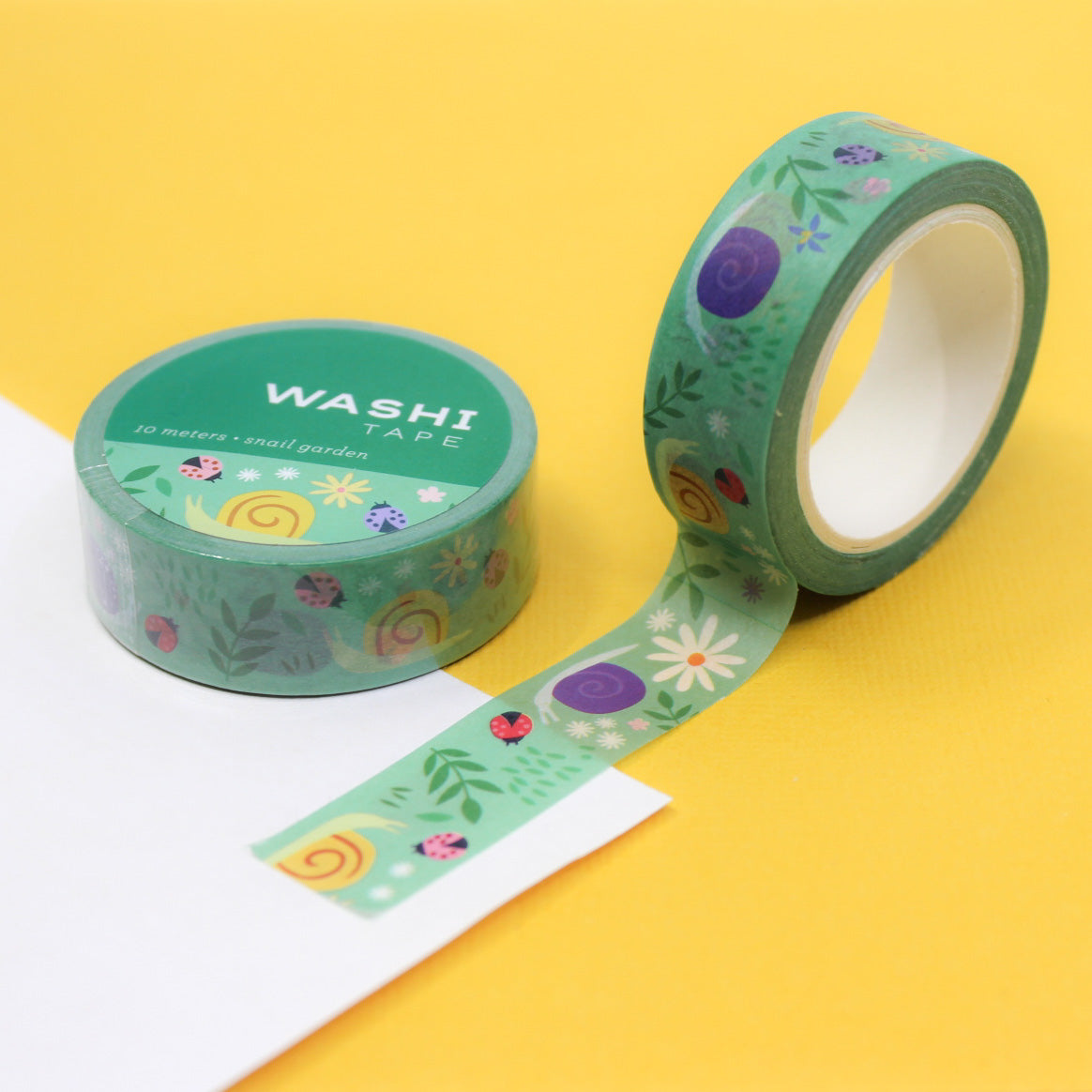  Garden Snail Washi Tape features charming illustrations of garden snails, perfect for adding a whimsical touch to your crafts, journals, and projects. This tape is from Girl of All Work and sold at BBB Supplies Craft Shop.